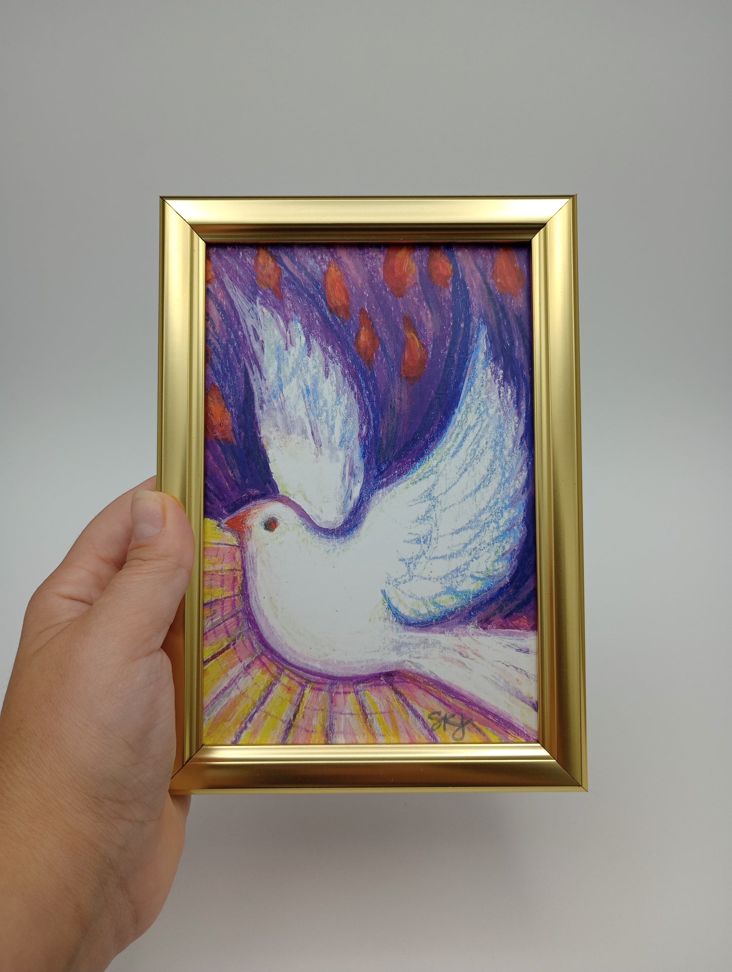 a painting of a white bird in a gold frame