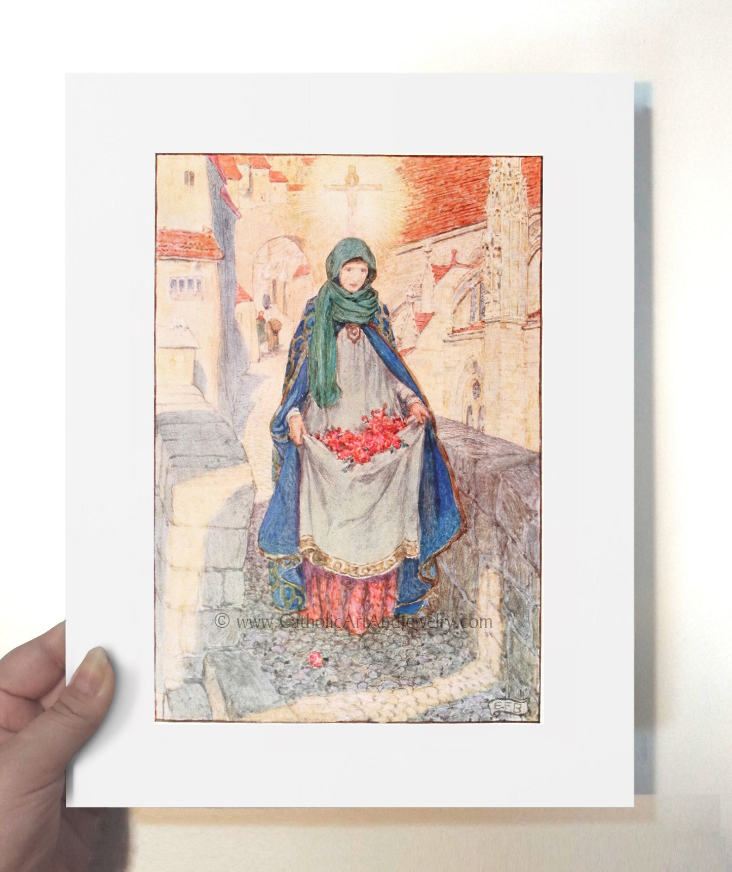 a person holding up a picture of a woman
