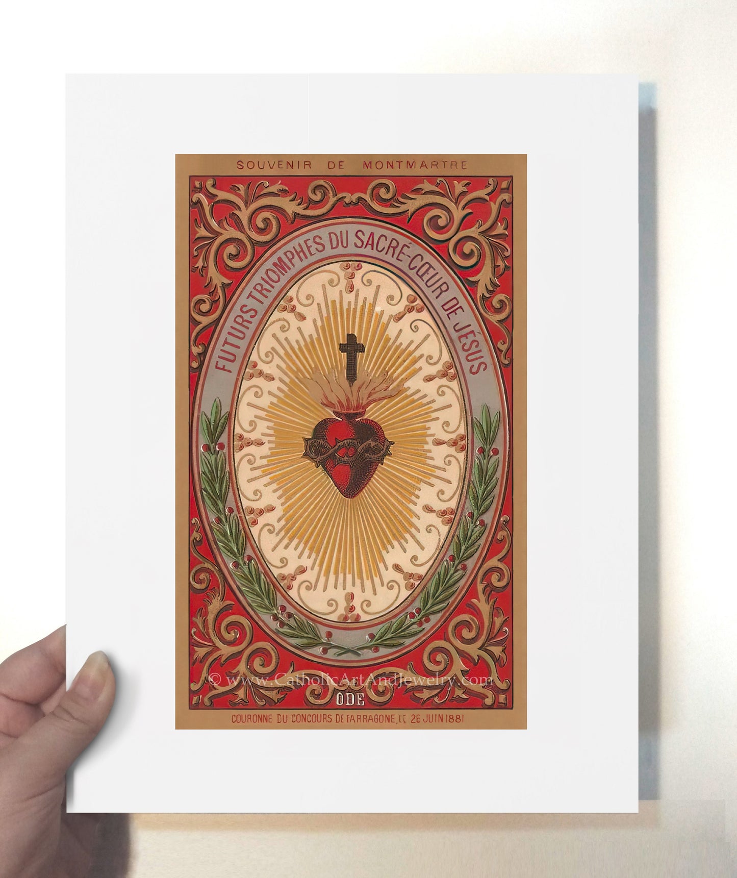 a hand holding a card with a heart on it