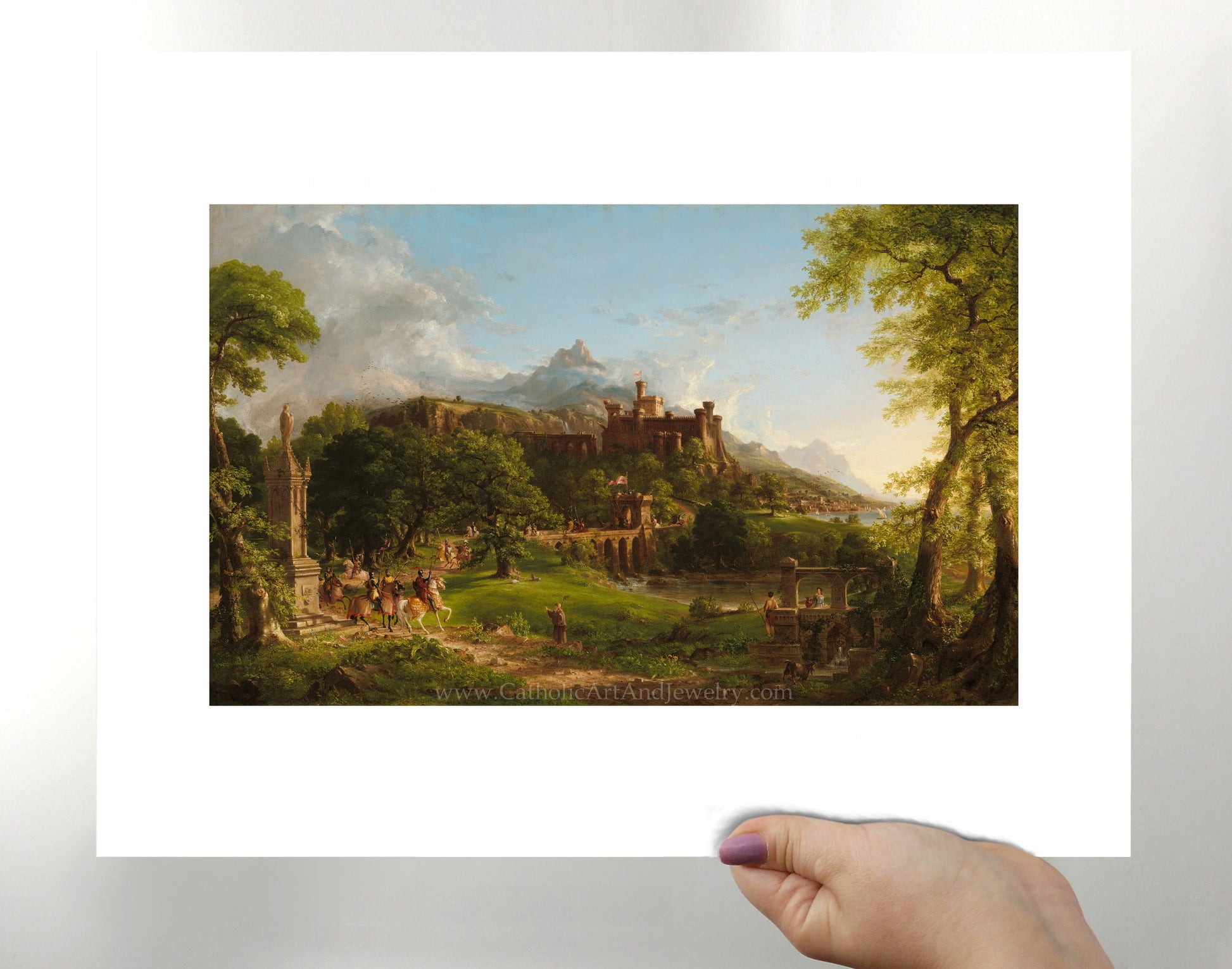 a person holding up a picture of a castle