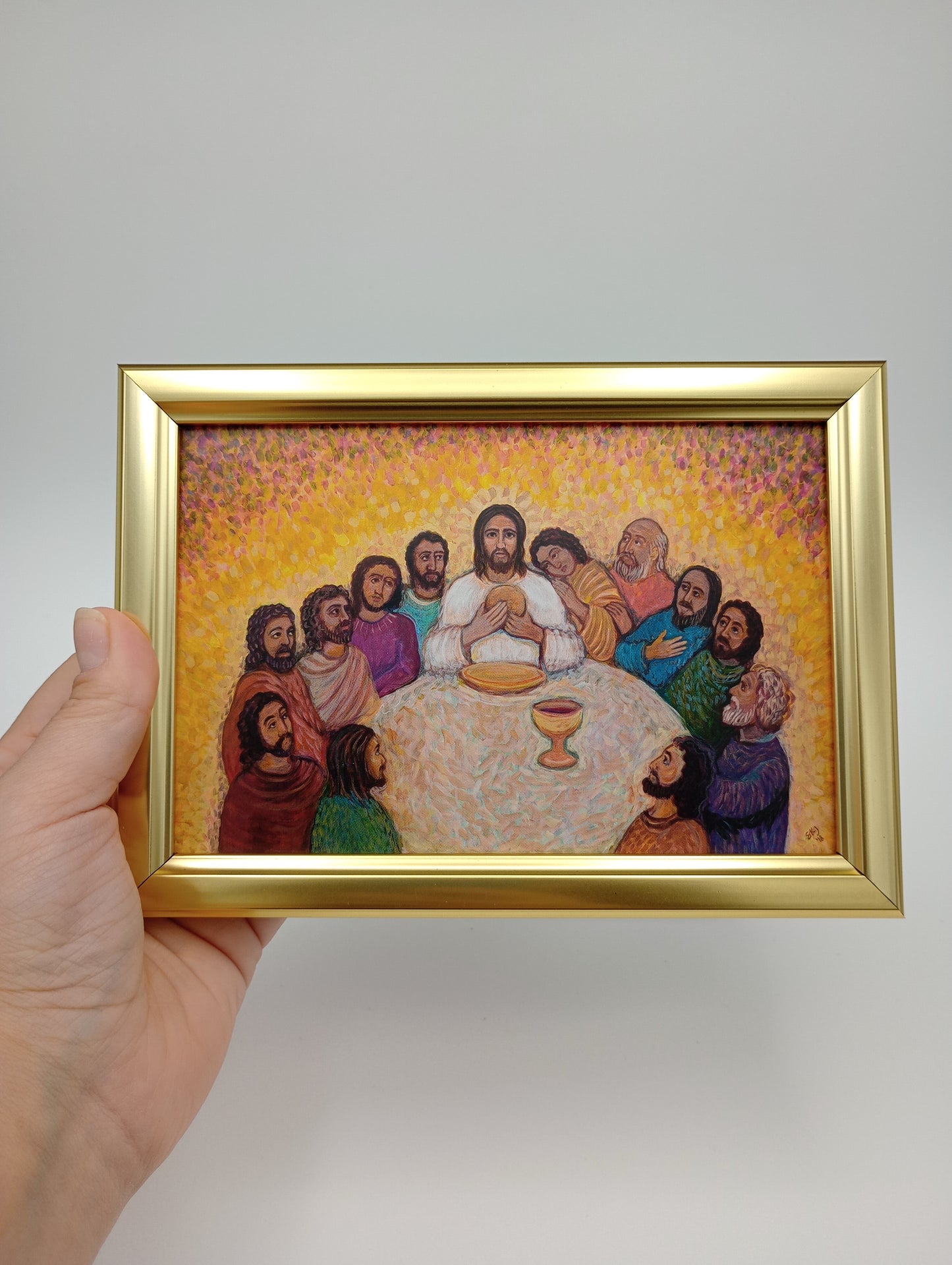 a painting of a group of people in a gold frame