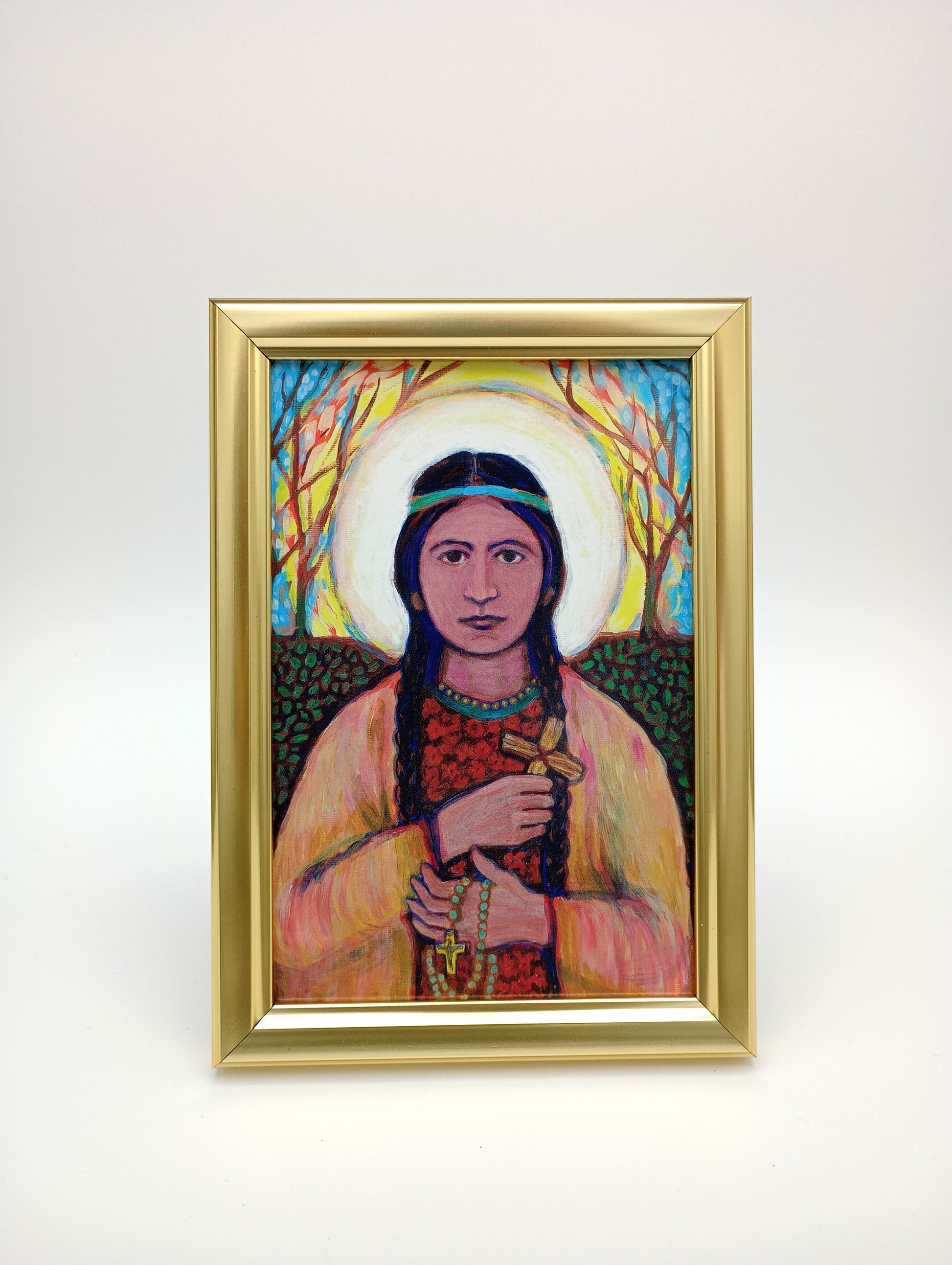 a painting of a woman in a gold frame