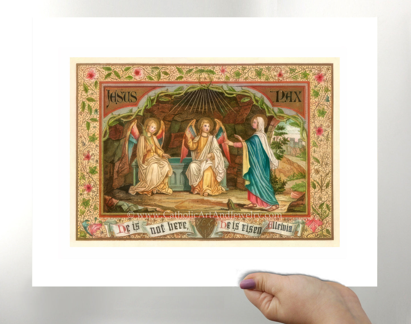 a person holding up a picture of a painting