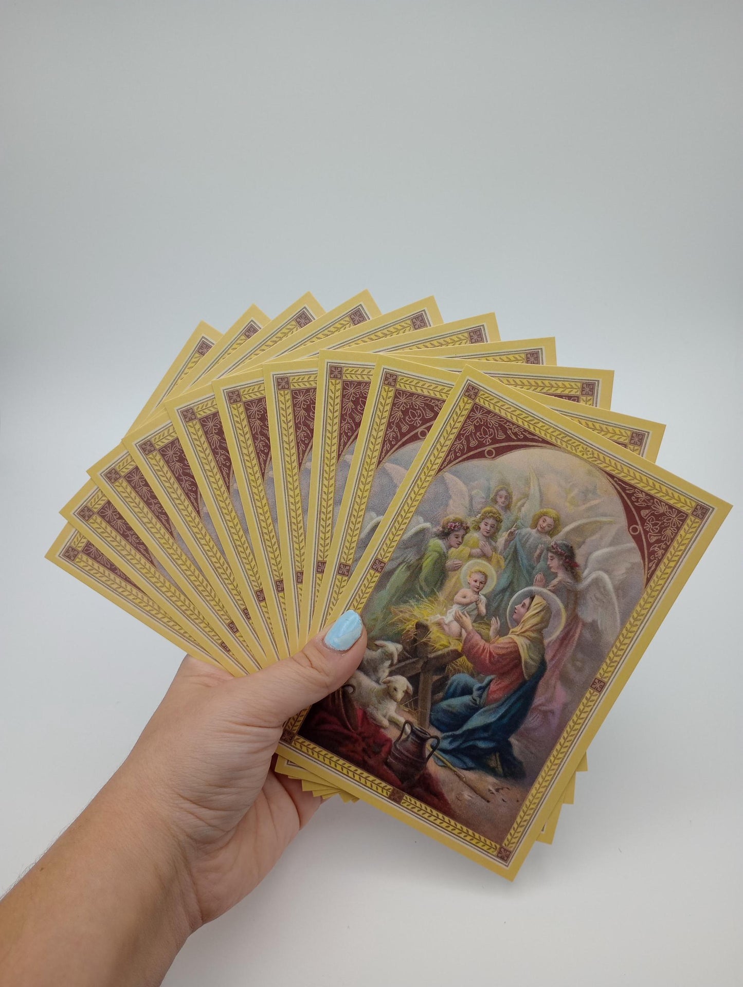a person holding a bunch of cards in their hand