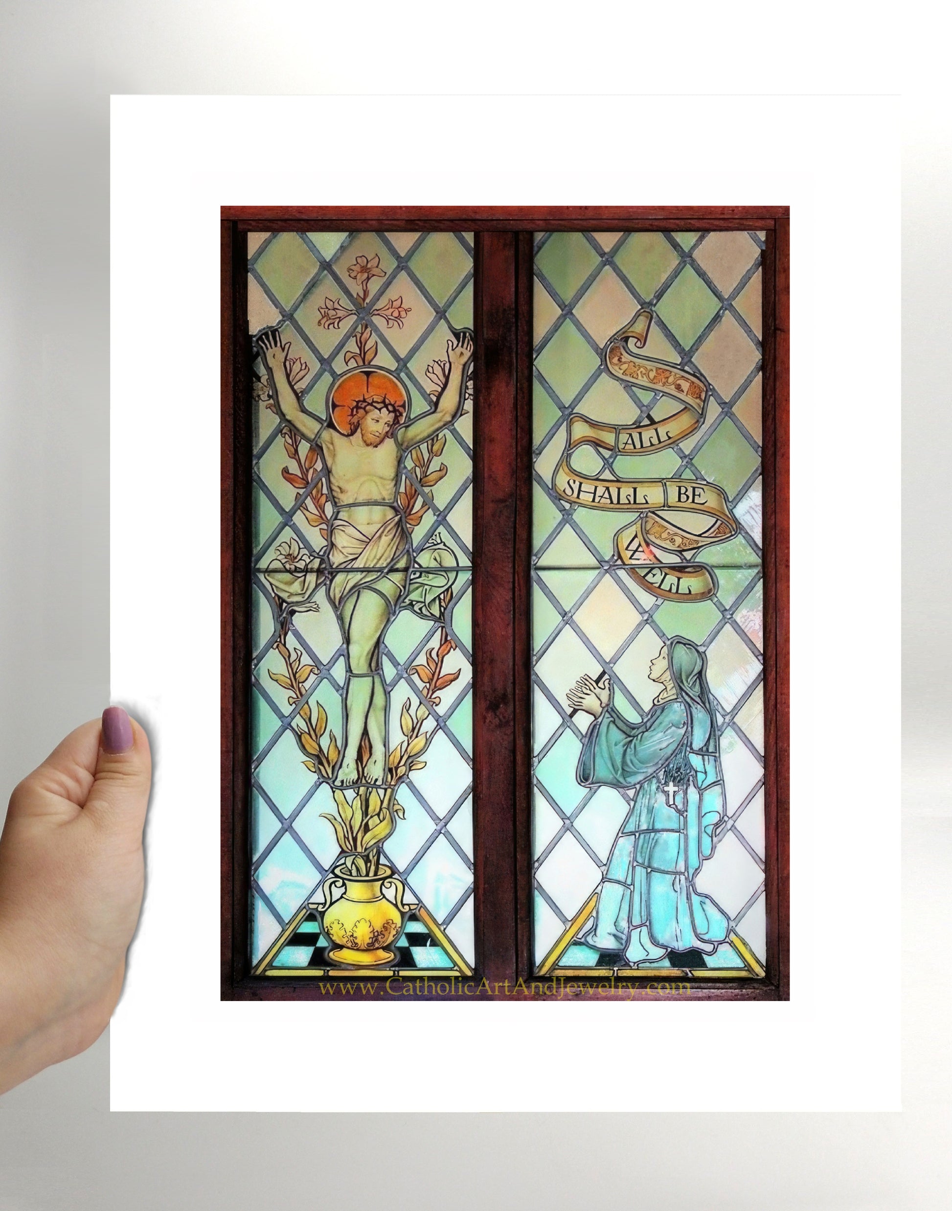 a hand holding a card with a stained glass window