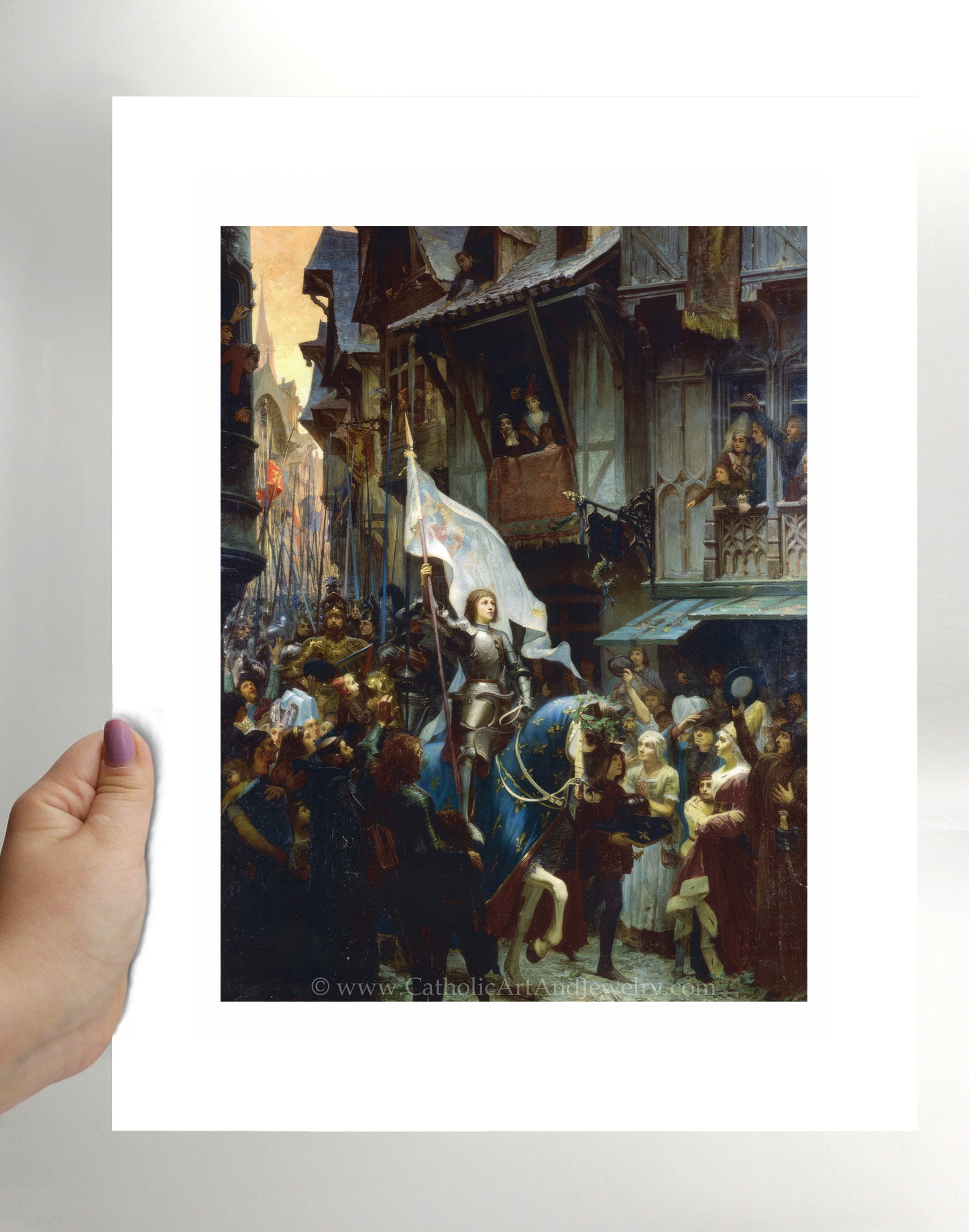 a person holding up a picture of a man on a horse
