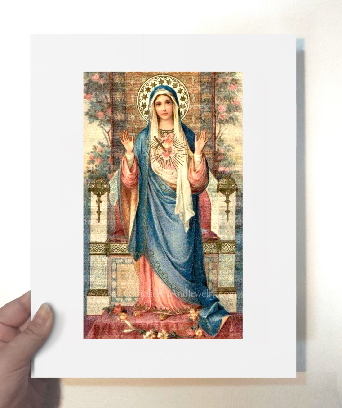a painting of the virgin mary holding up a card