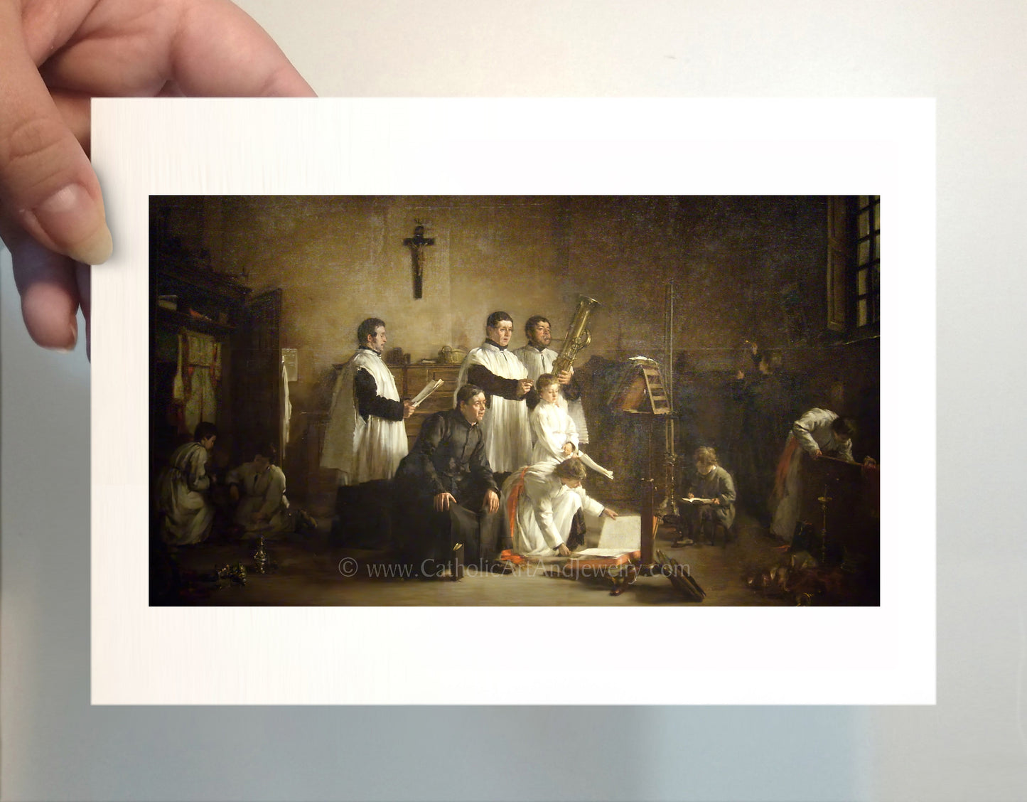 a person holding a picture of a group of people