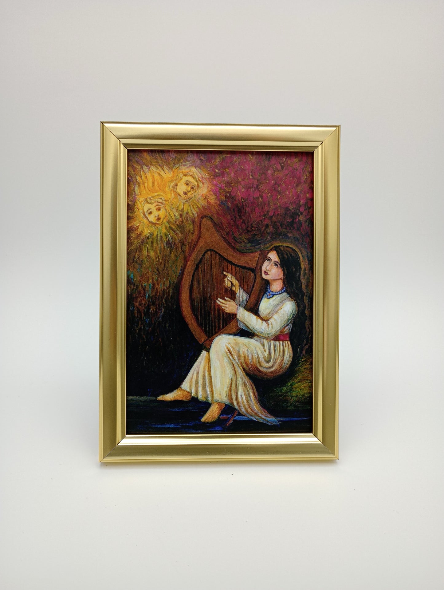 a painting hanging on a wall above a painting