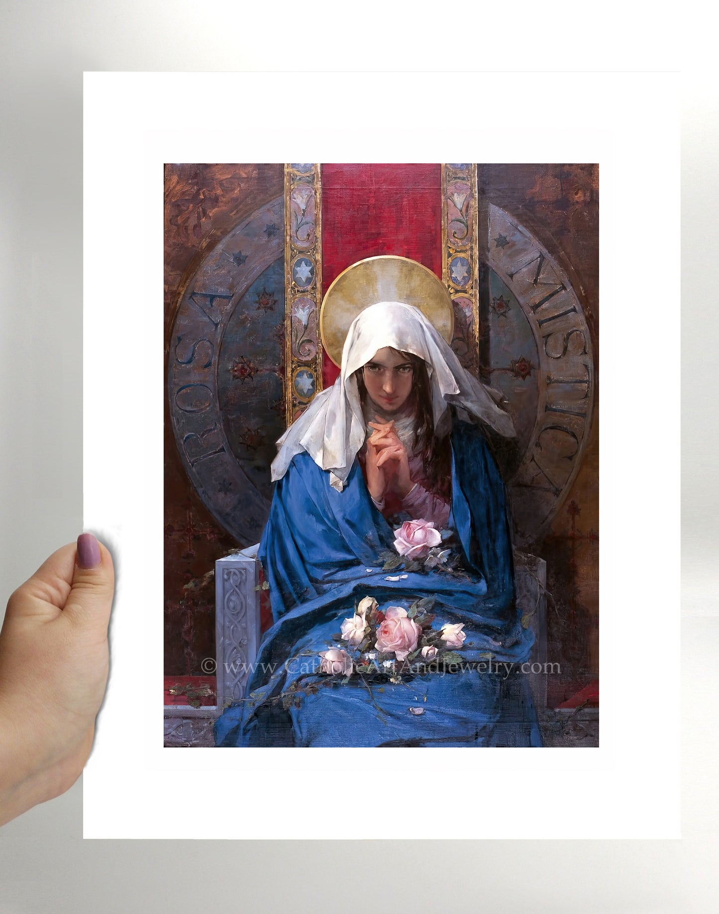 a person holding a picture of a nun