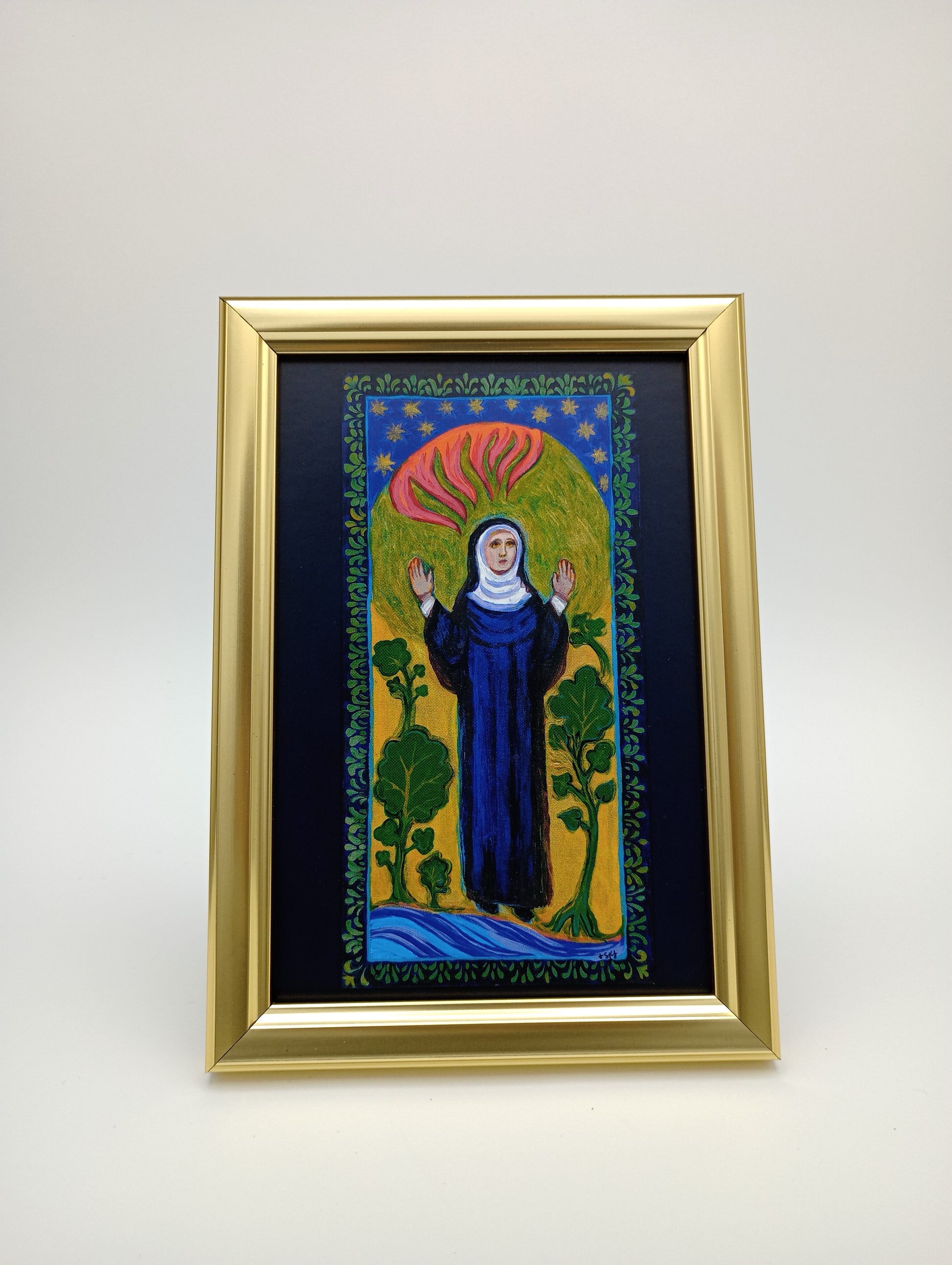 a painting hanging on a wall with a gold frame