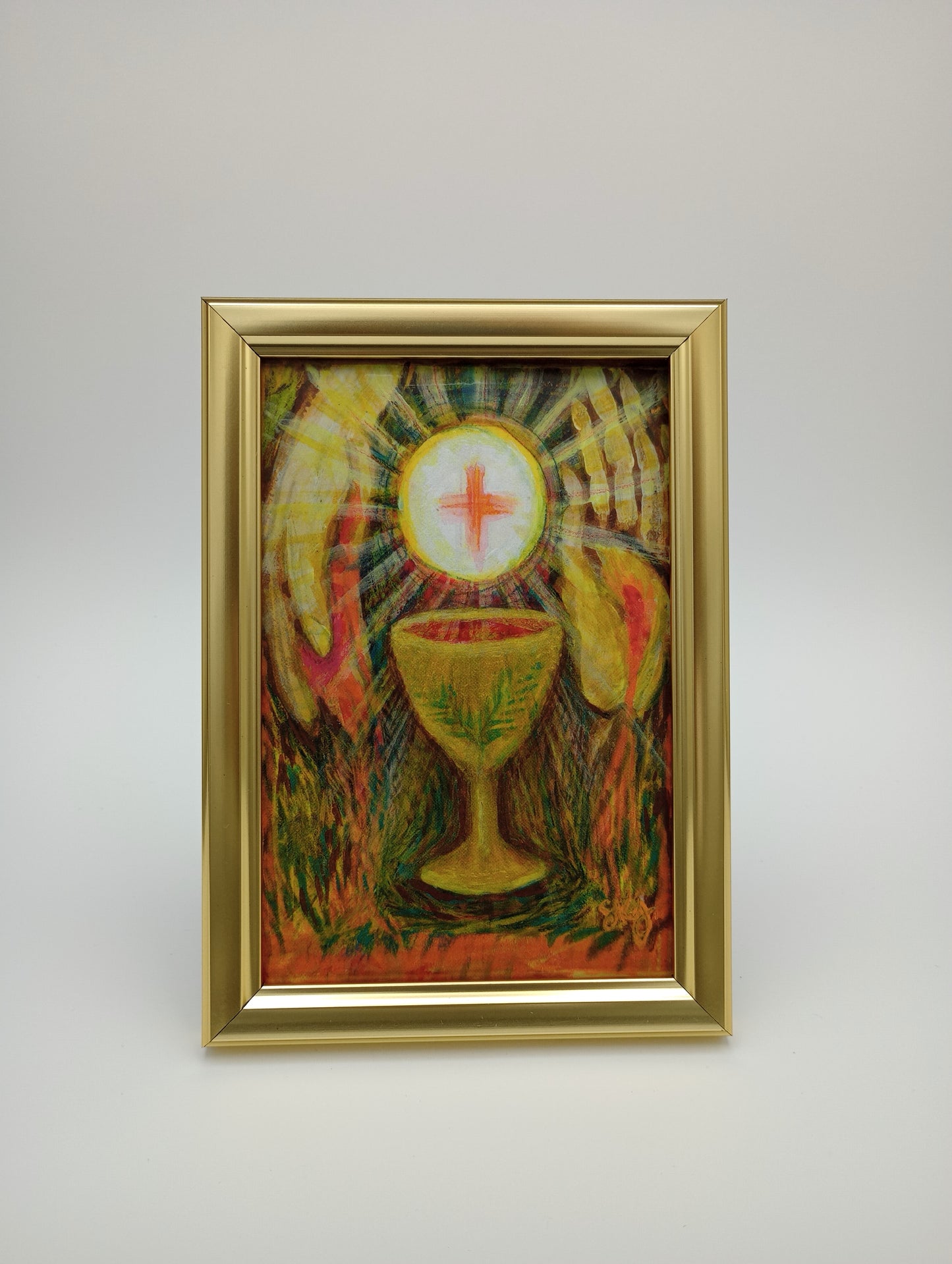 a painting hanging on a wall with a gold frame