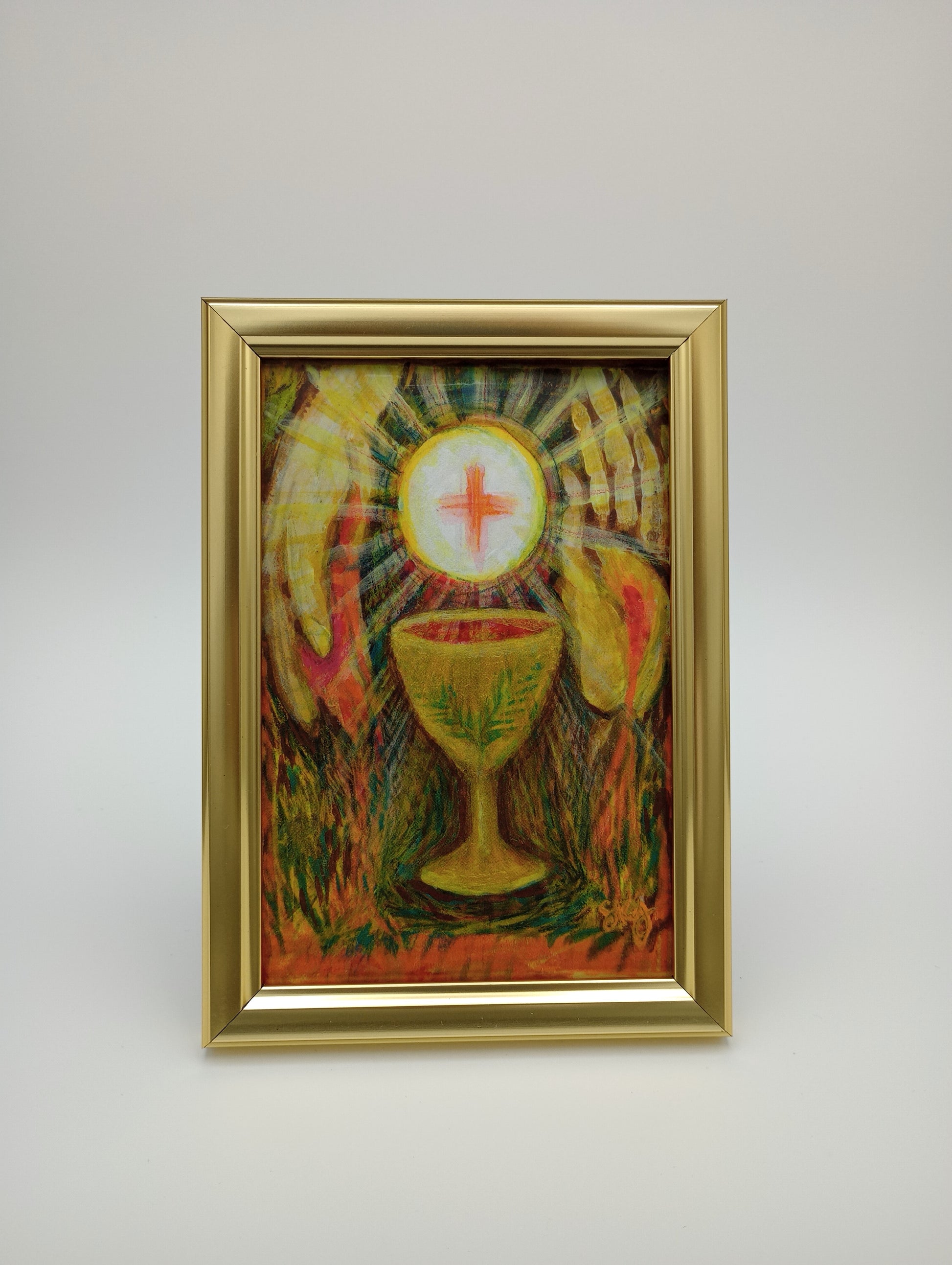 a painting hanging on a wall with a gold frame