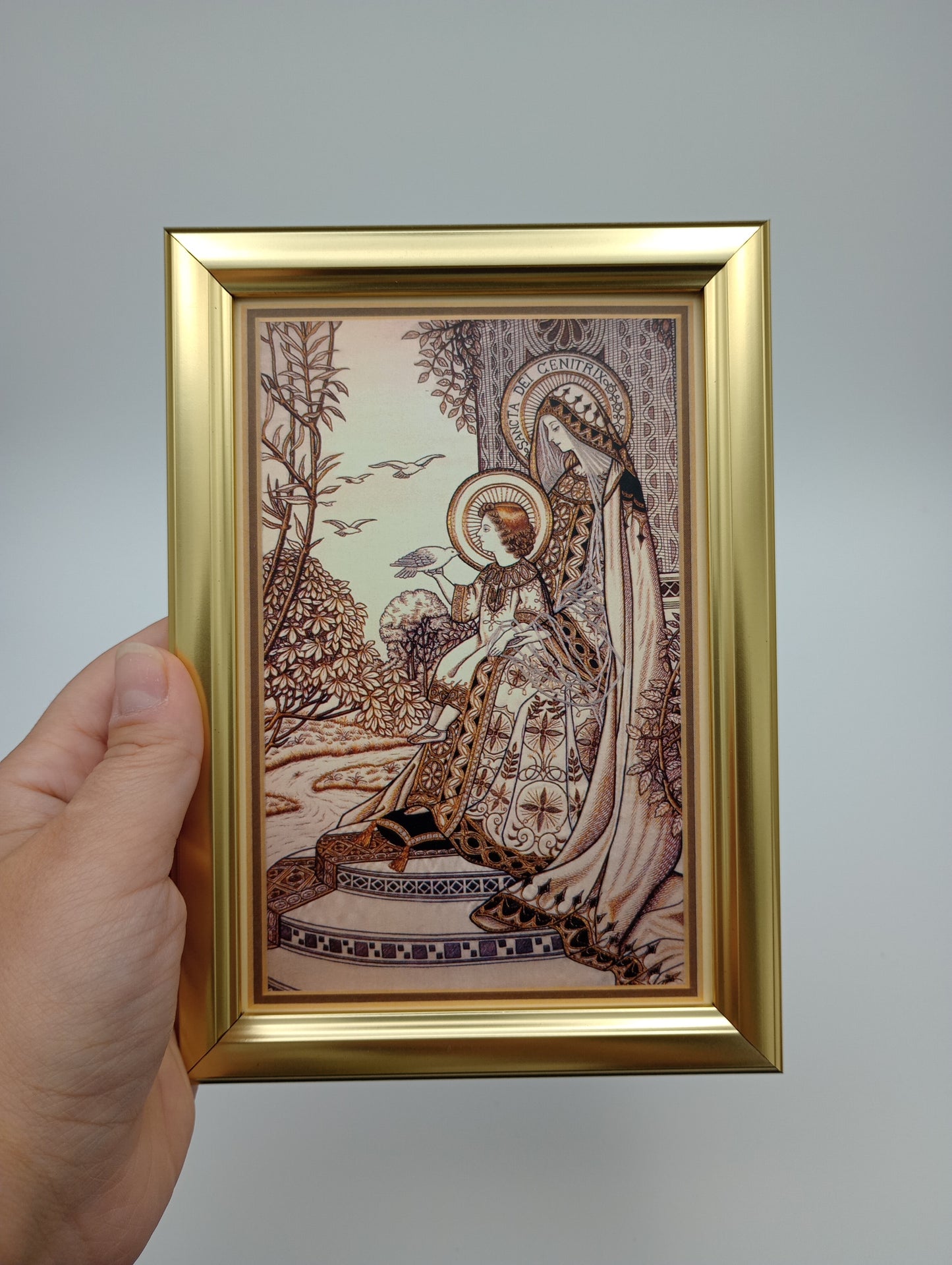 a person holding up a picture of a snake