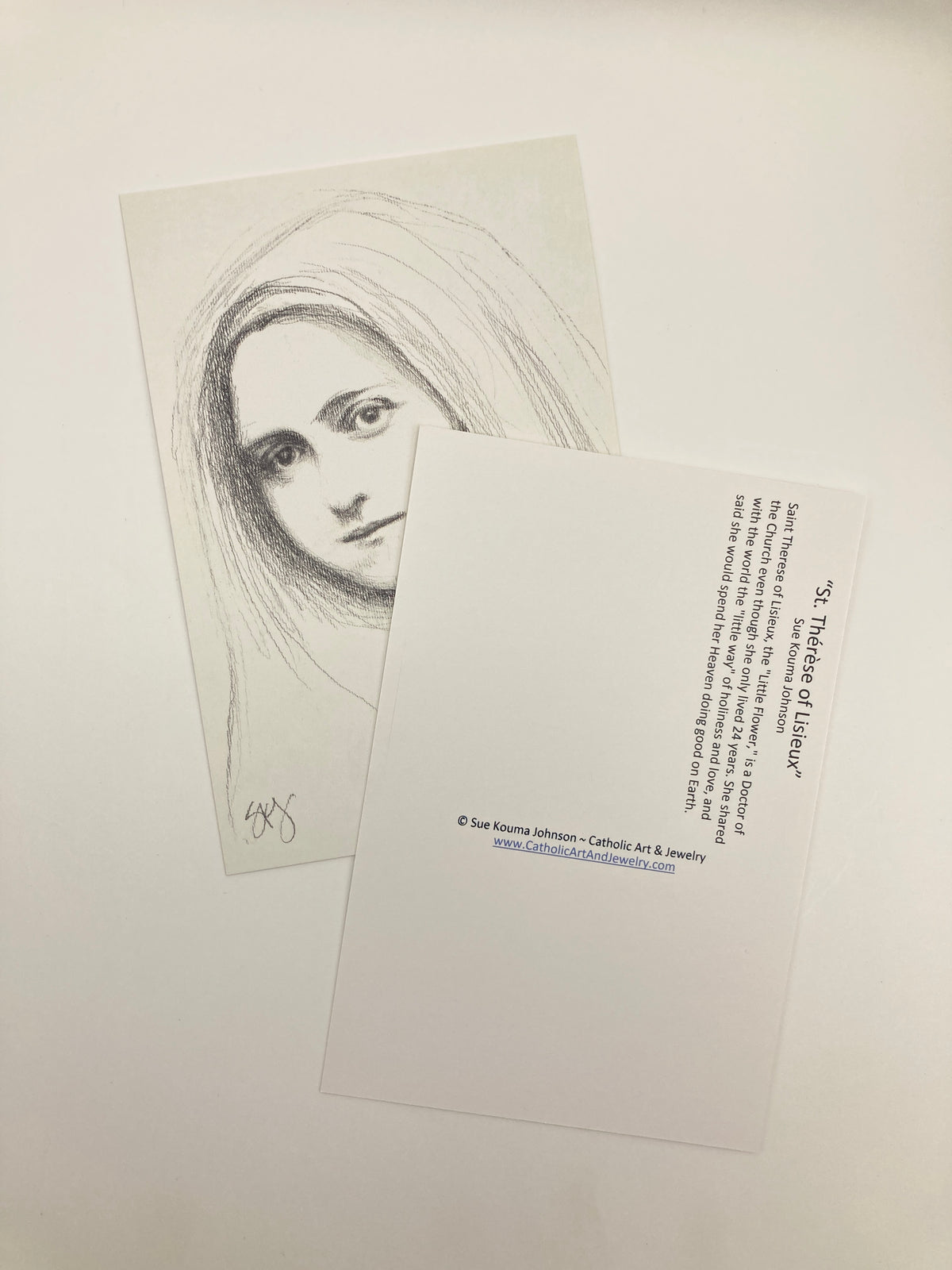 a sketch of a woman's face with a caption describing her as a "Saint Theres of Lisieux" and her role as a "Doctor of the Church".