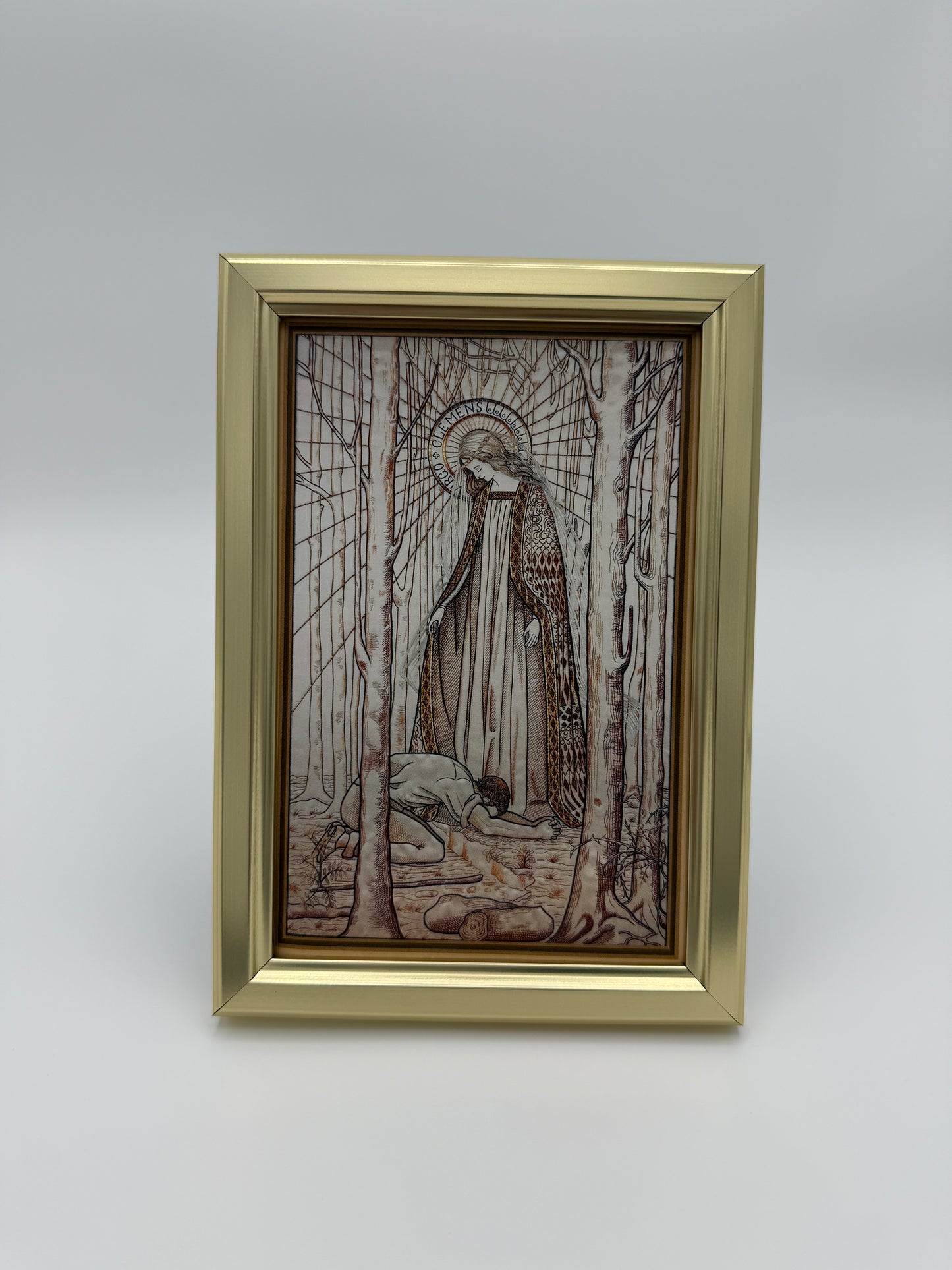 The image is a framed artwork depicting a person sitting in a chair, surrounded by a bird and a tree.