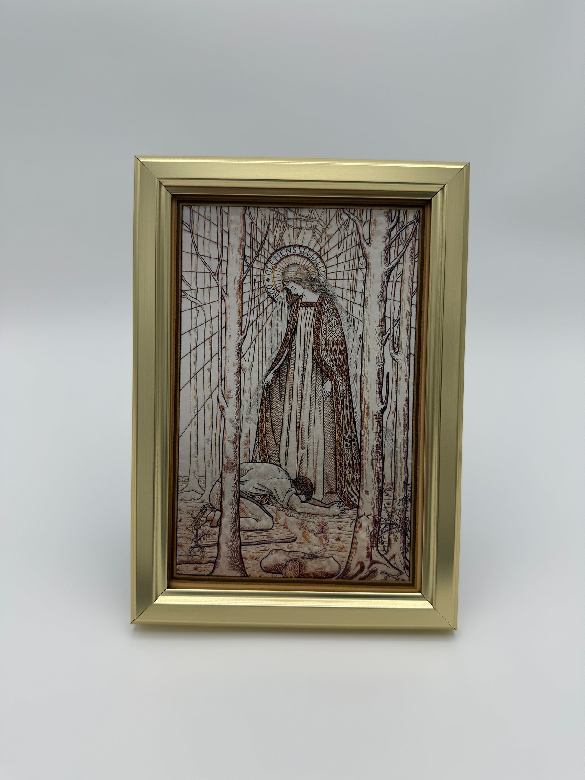 The image is a framed artwork depicting a person sitting in a chair, surrounded by a bird and a tree.