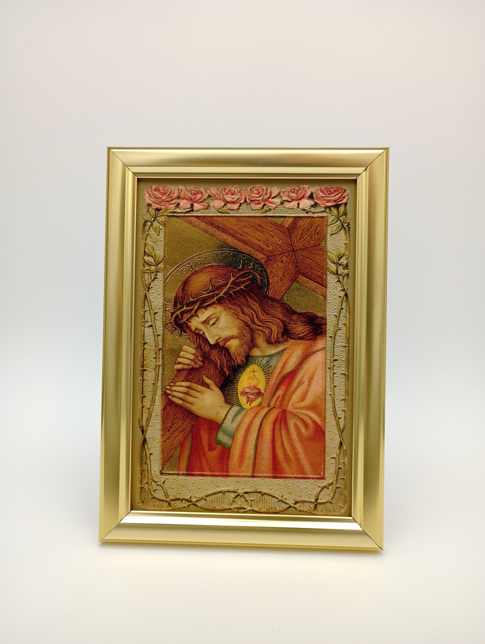 a painting of jesus in a gold frame