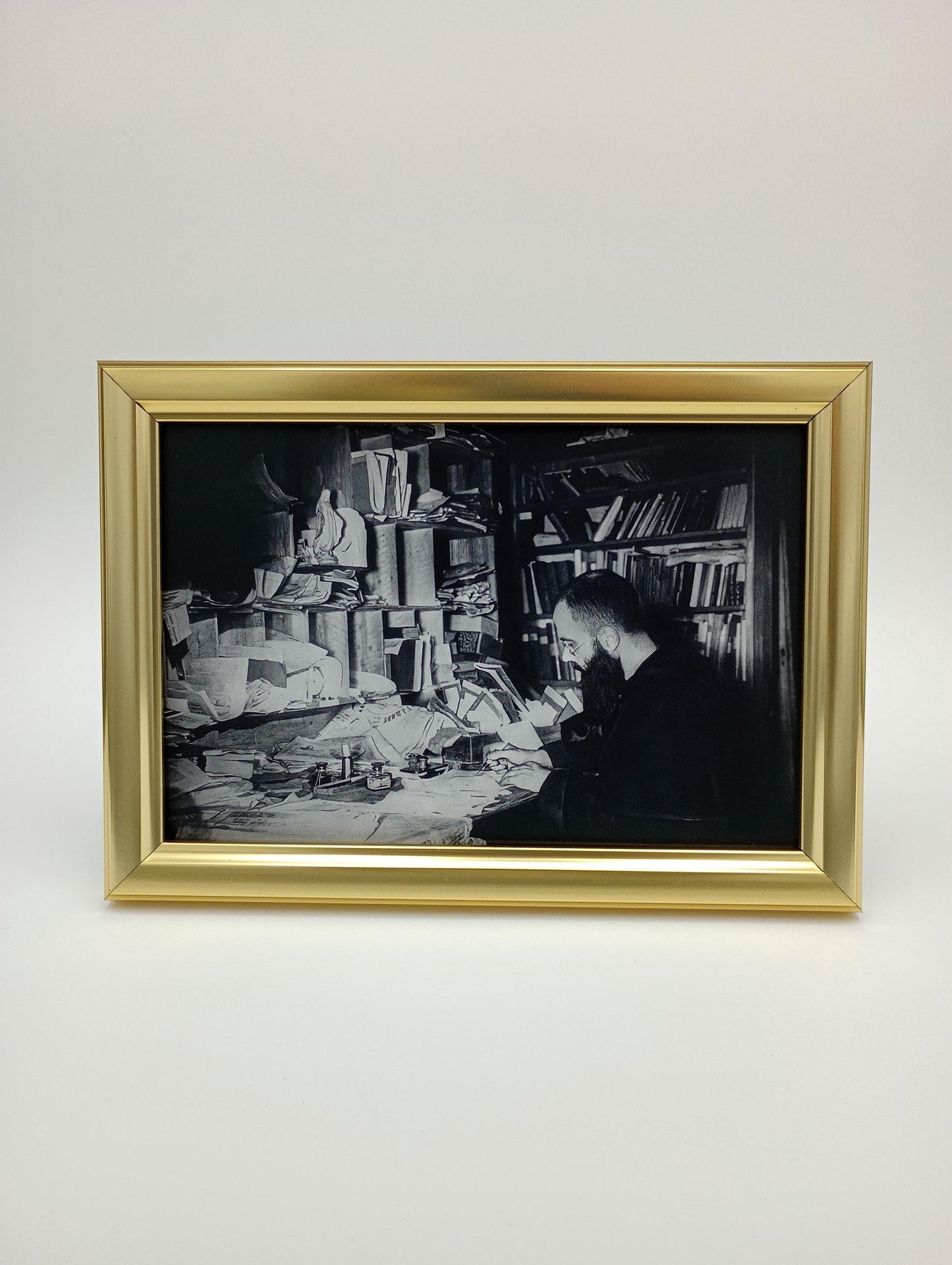 a black and white photo hanging on a wall