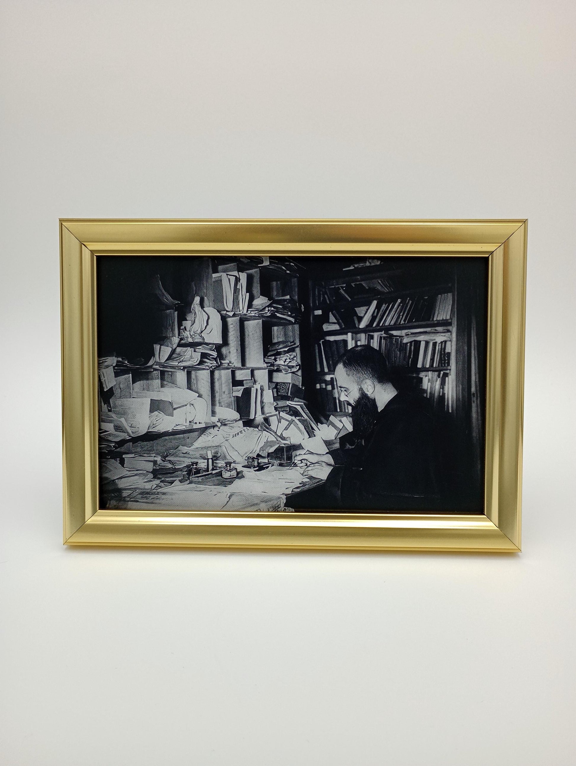 a black and white photo hanging on a wall