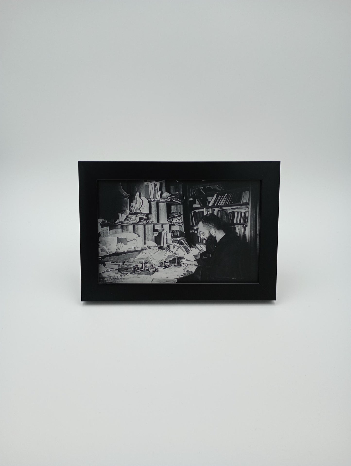 a black and white photo hanging on a wall
