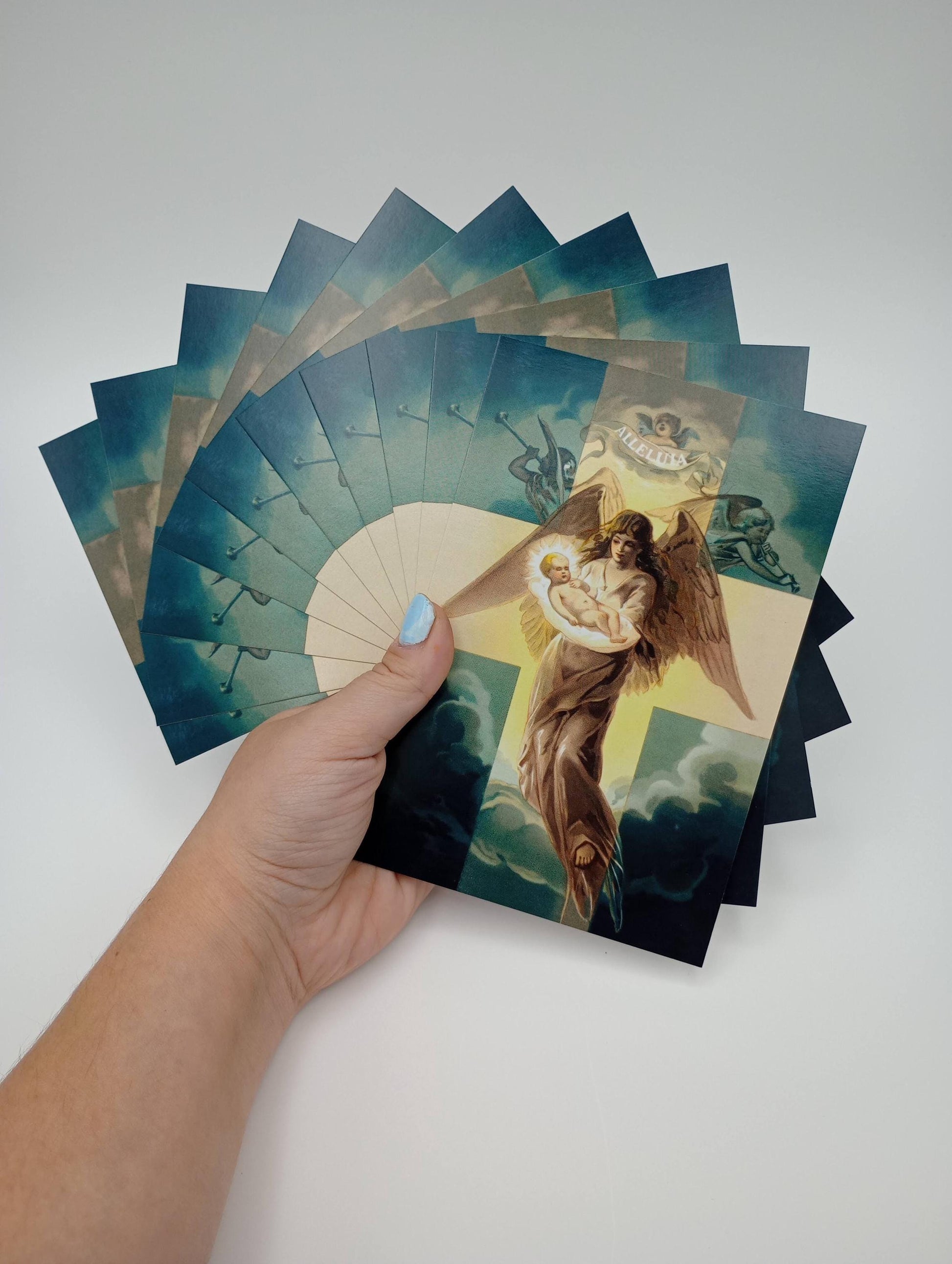 a hand holding a card with a picture of a person on it