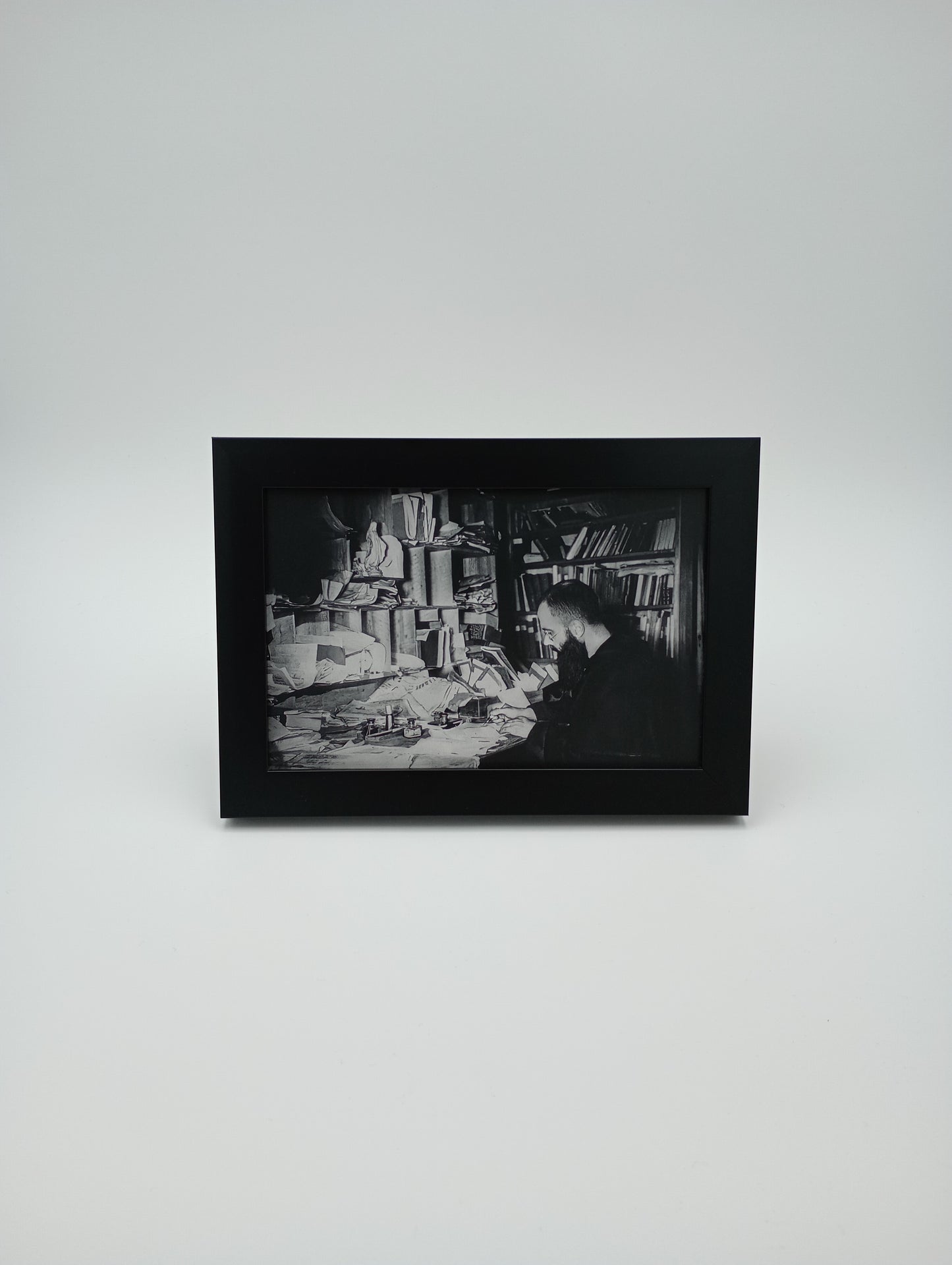 a black and white photo hanging on a wall