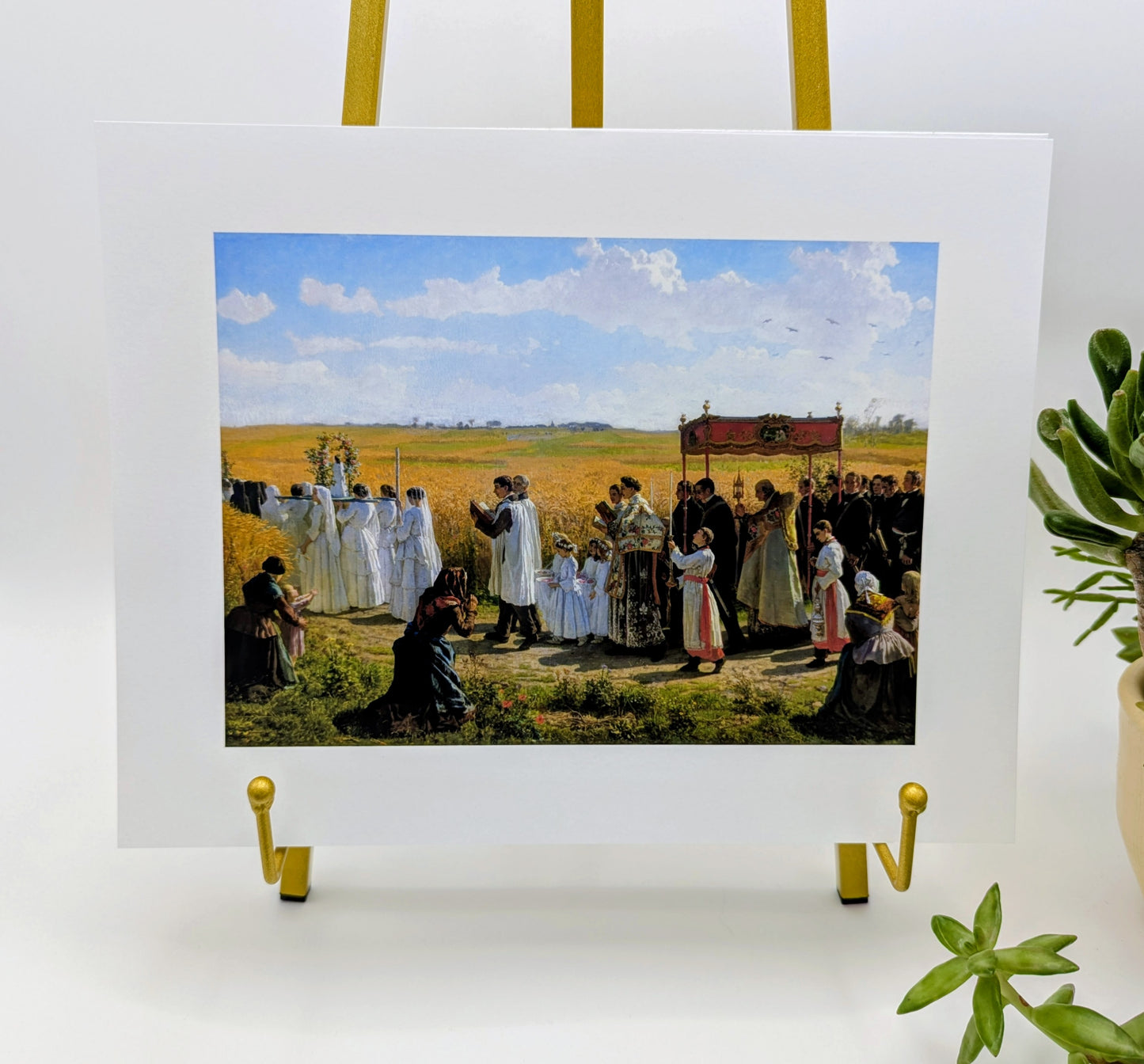 a group of people dressed in white robes and standing in a field, with some individuals holding banners or flags.