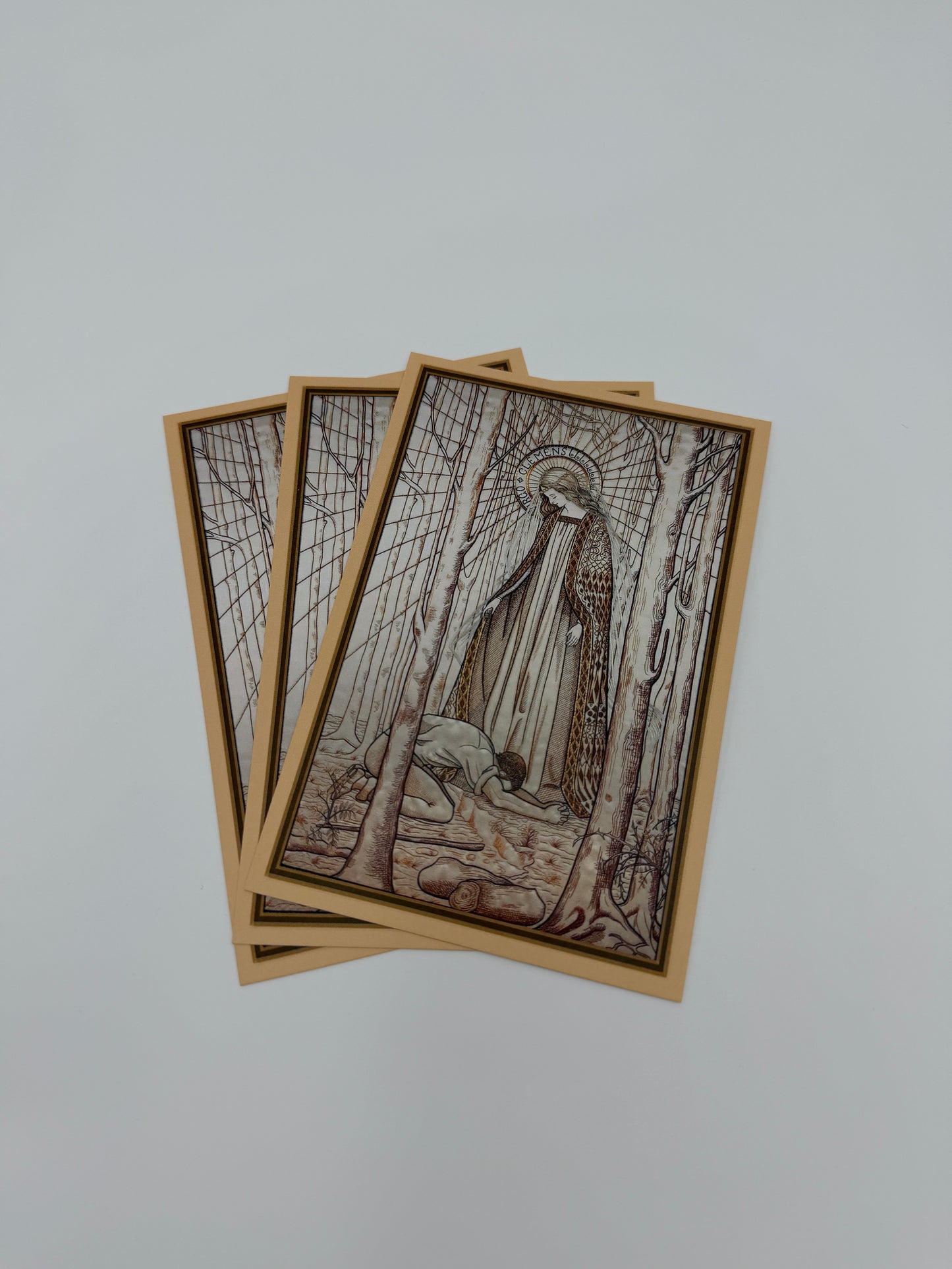 The image is a stack of three rectangular cards, each featuring an artistic illustration on the front.