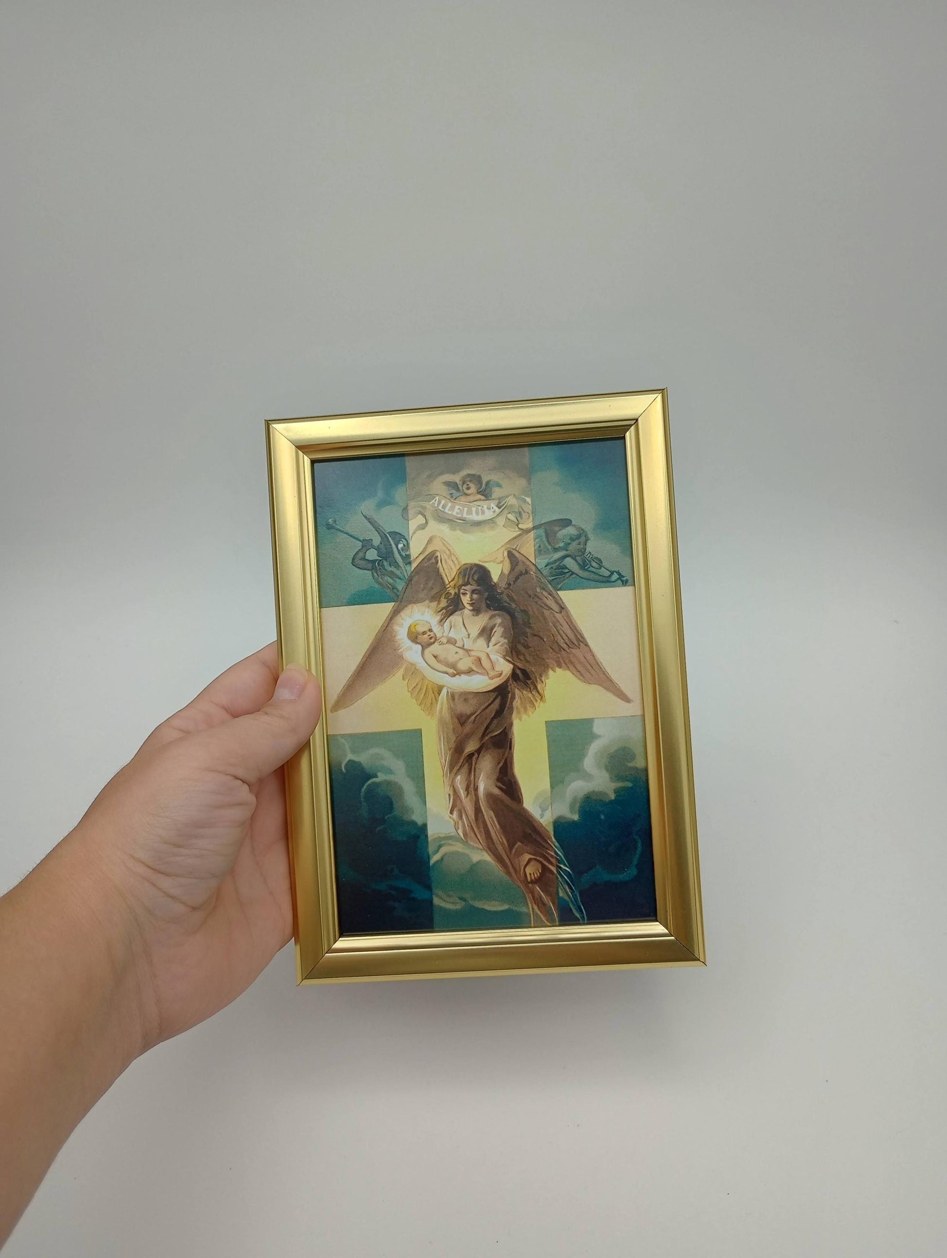 a painting of a woman holding a cross