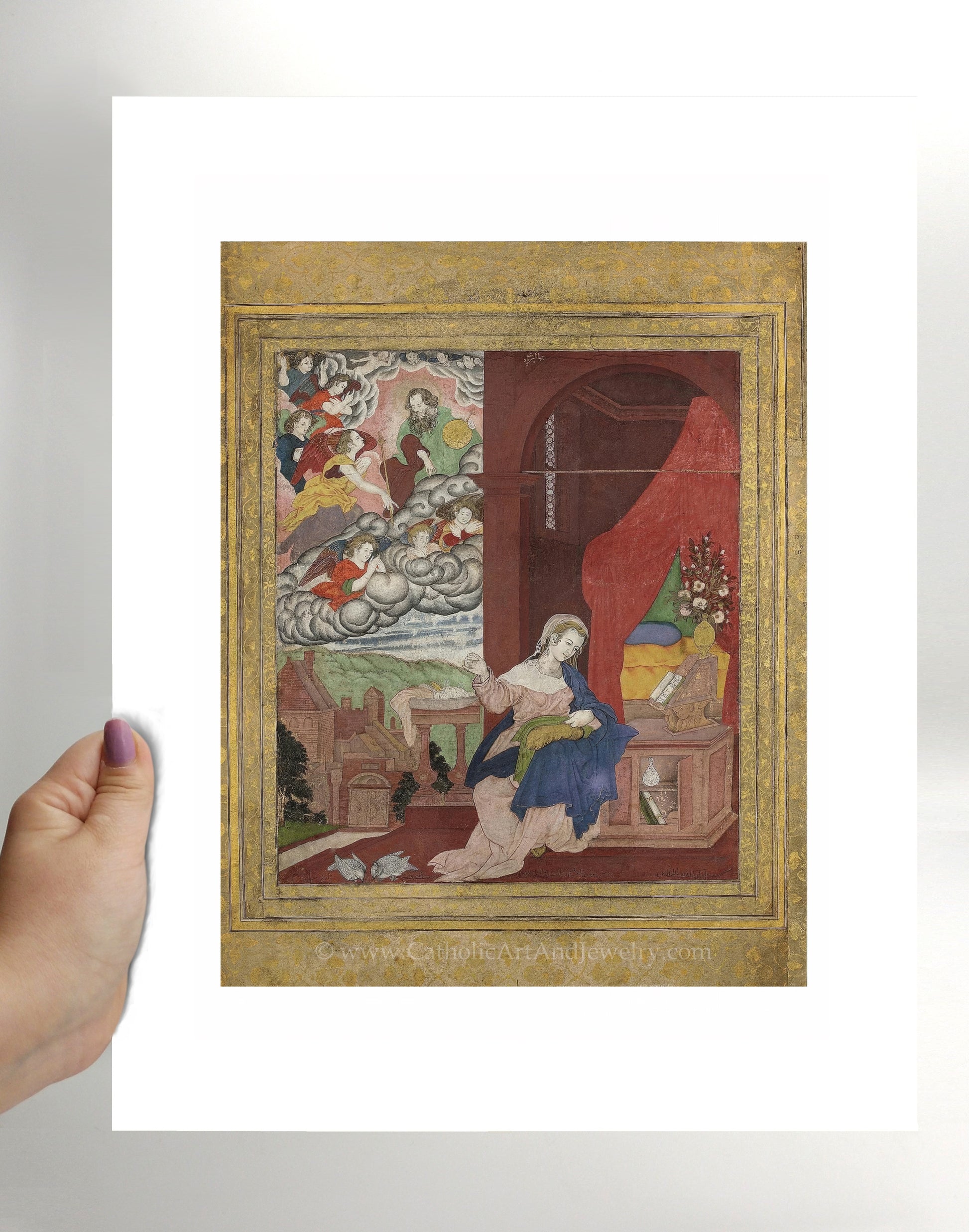 a person holding up a picture of a painting