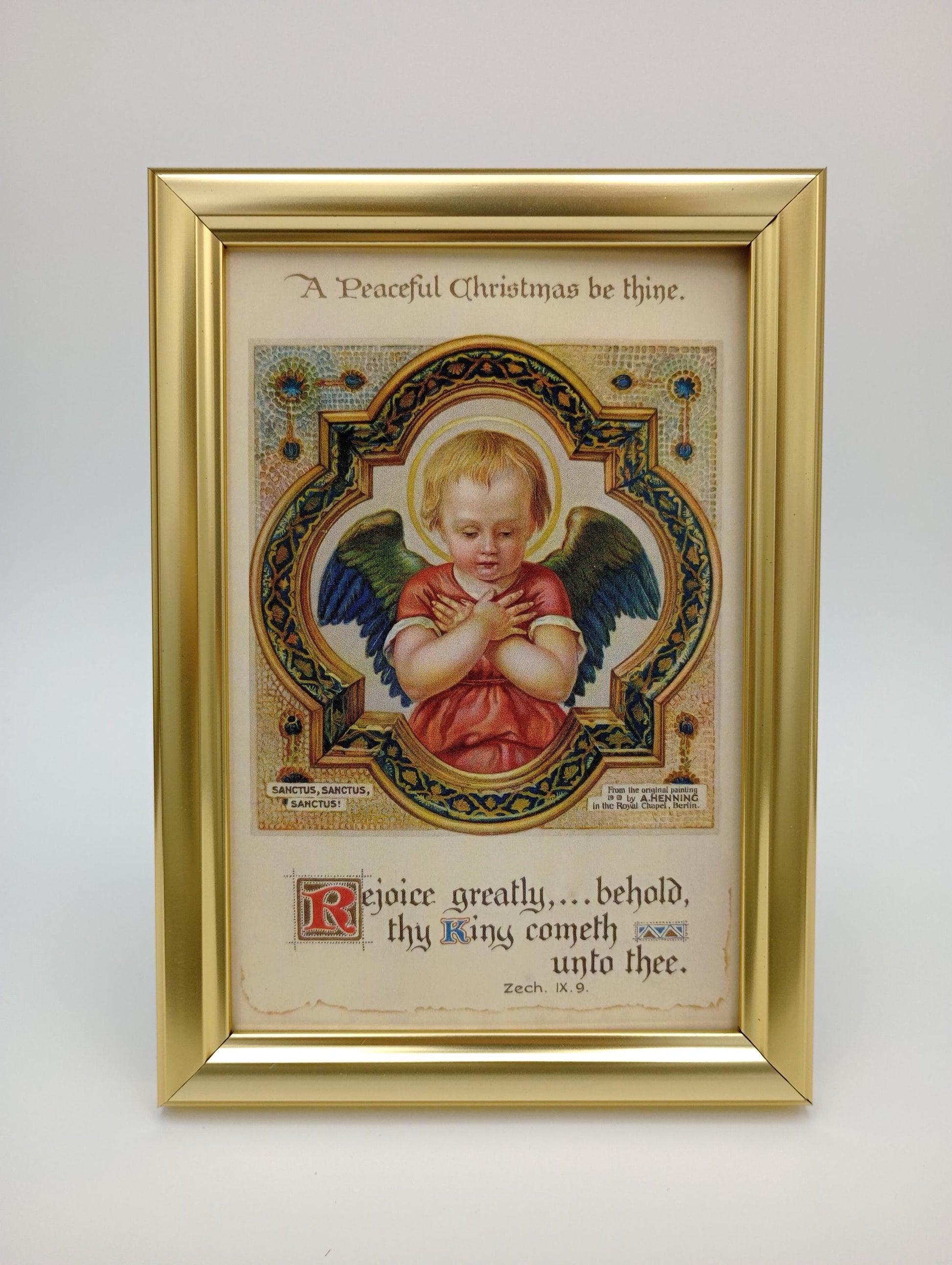 a picture of an angel with a gold frame