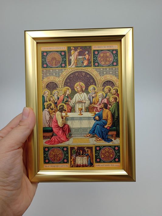 a person holding up a picture of a painting