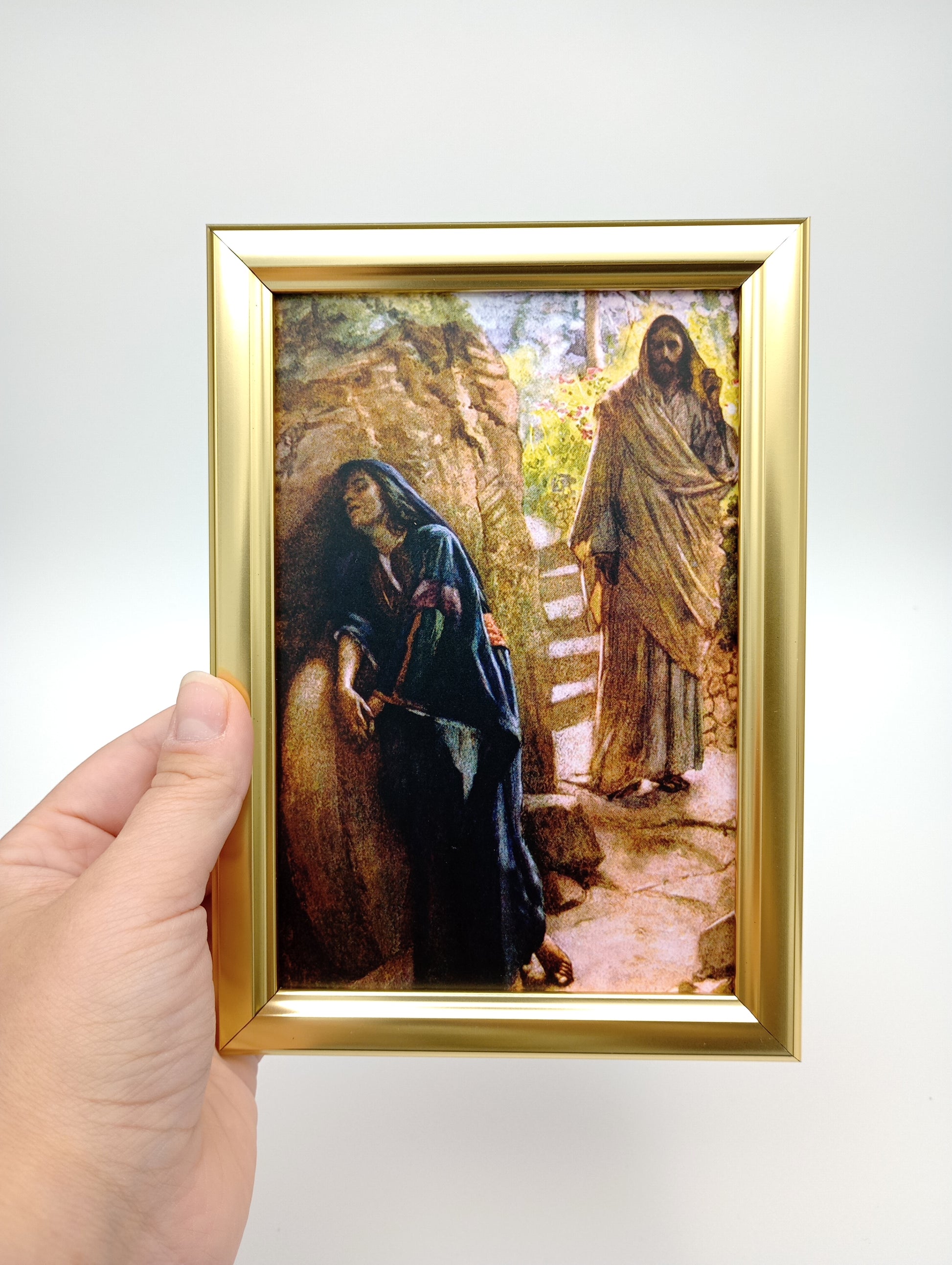 a person holding a picture of a bear in their hand