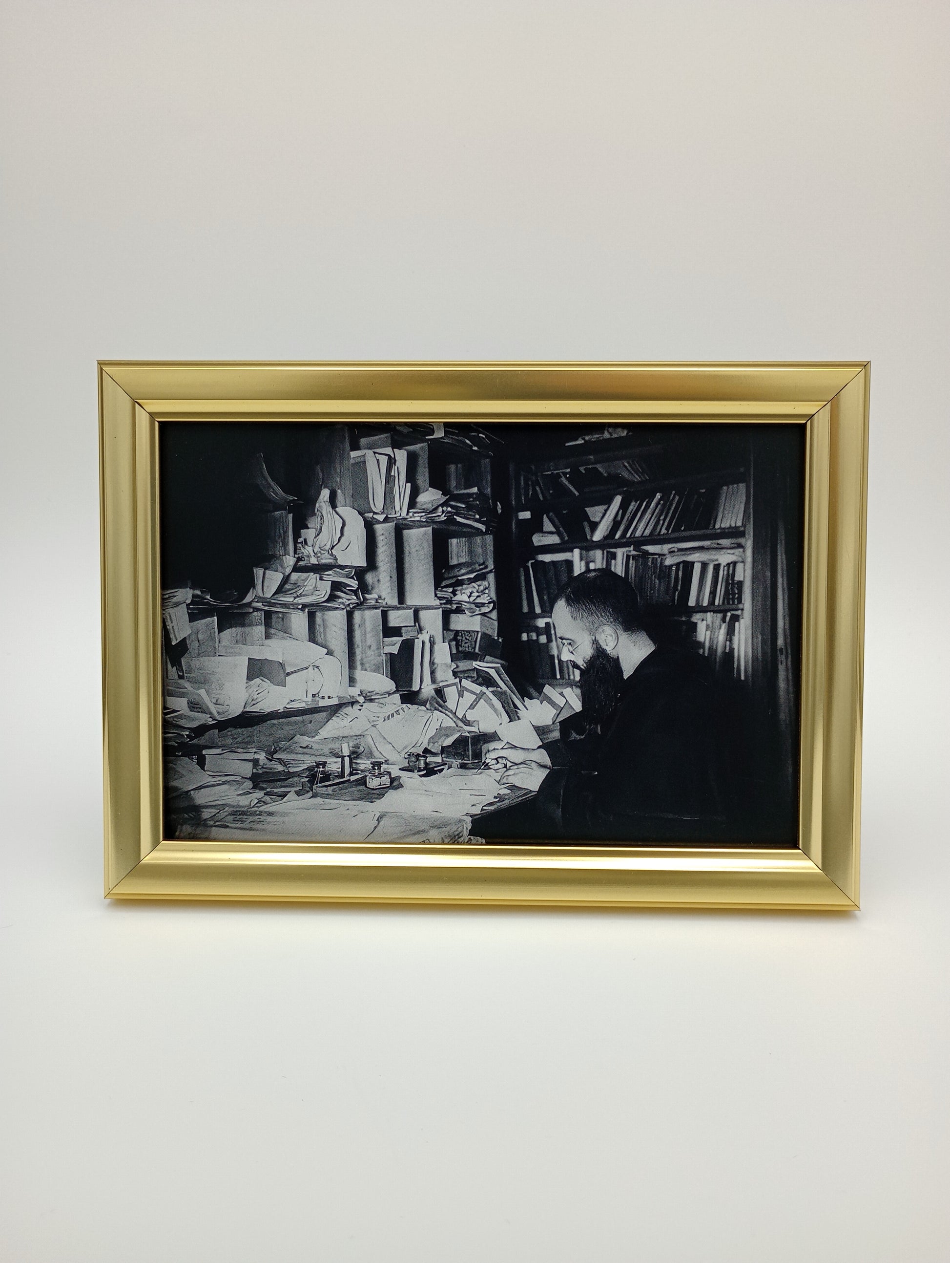 a black and white photo hanging on a wall