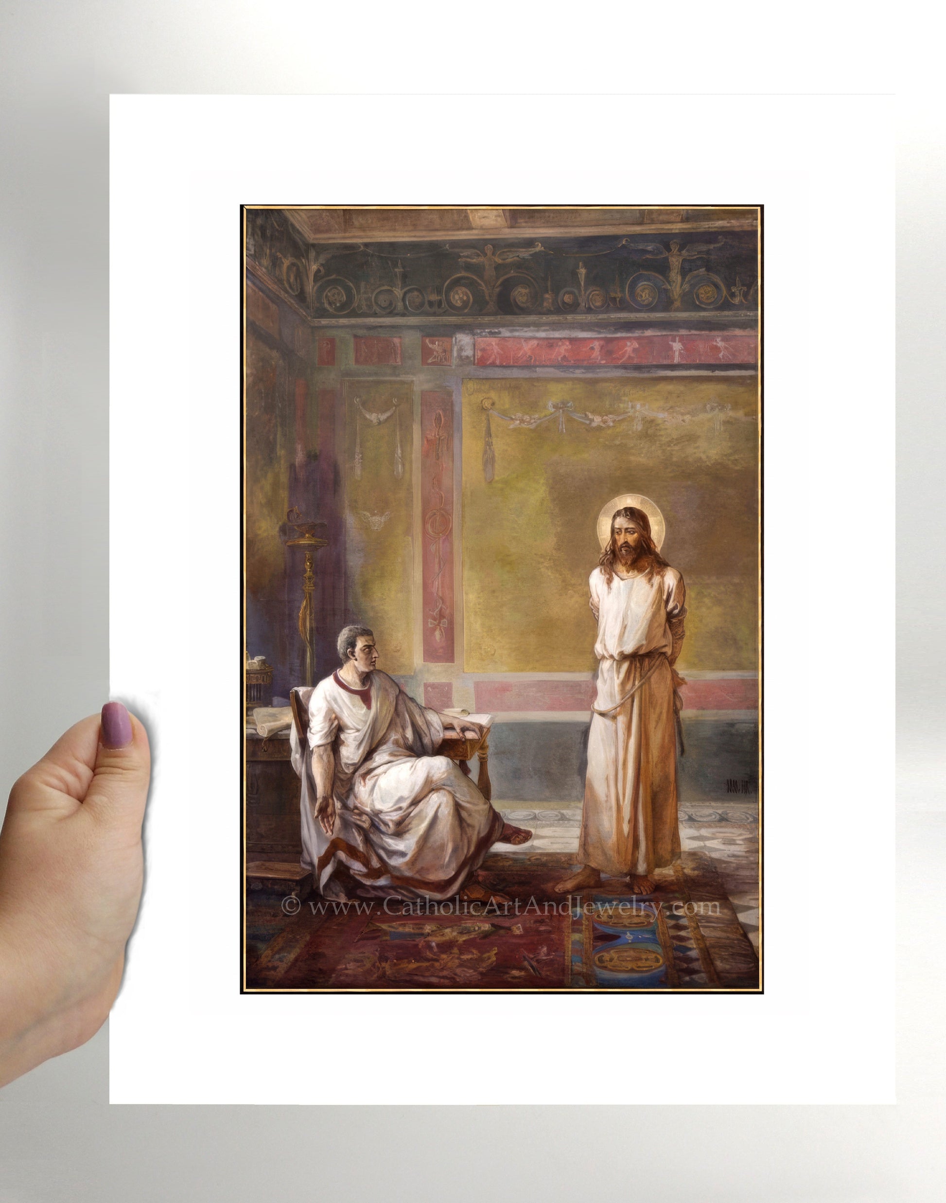 a person holding a picture of jesus and mary