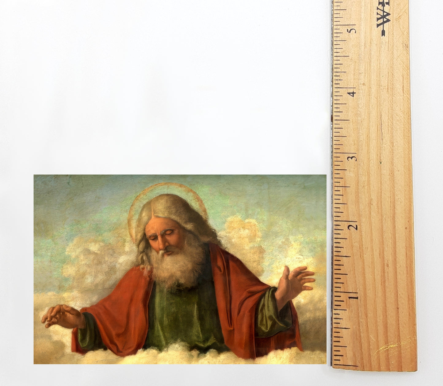 The image is a painting of a bearded man with a halo, wearing a red robe, and holding a book. The painting is set against a cloudy sky background.