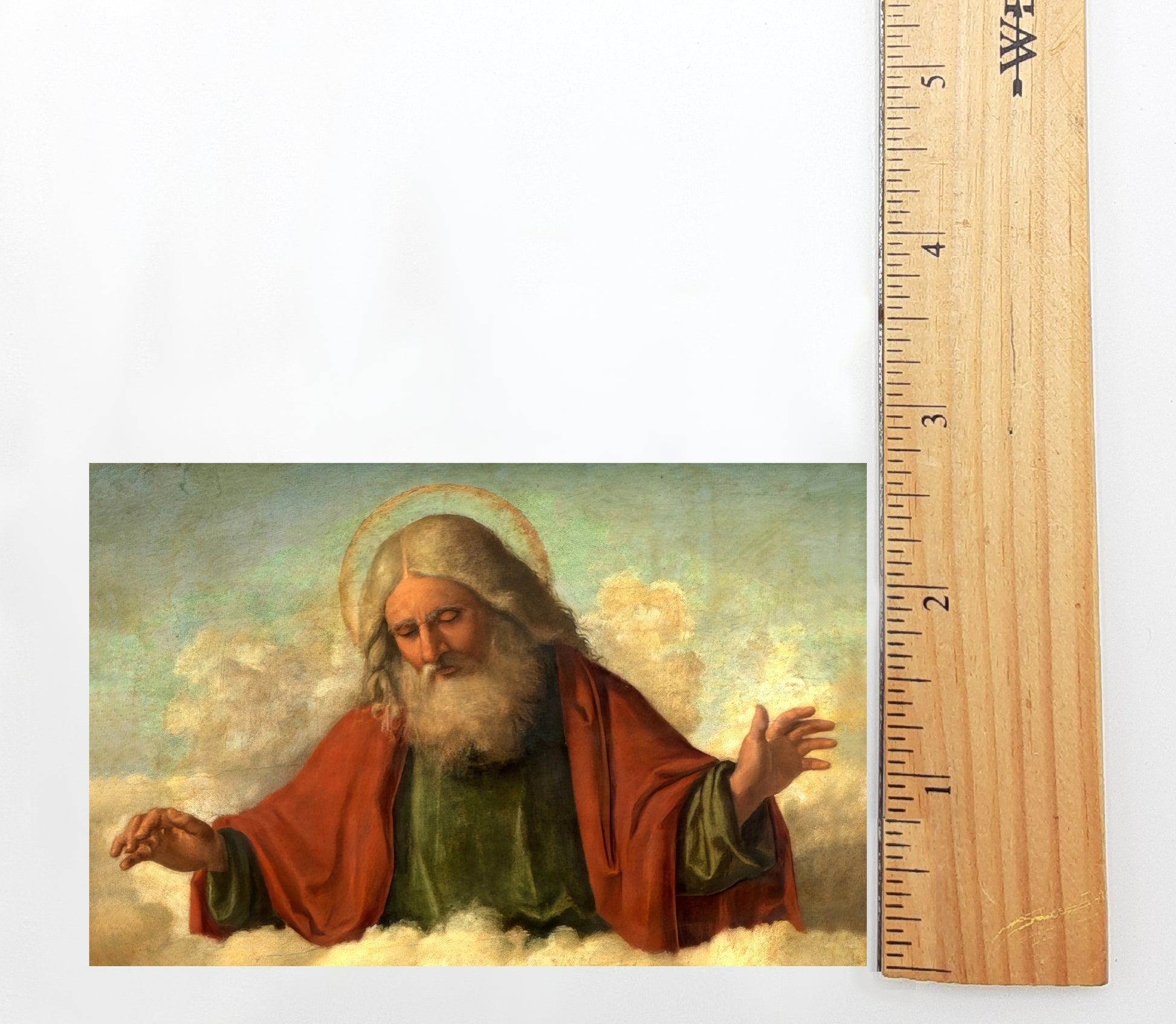 The image is a painting of a bearded man with a halo, wearing a red robe, and holding a book. The painting is set against a cloudy sky background.