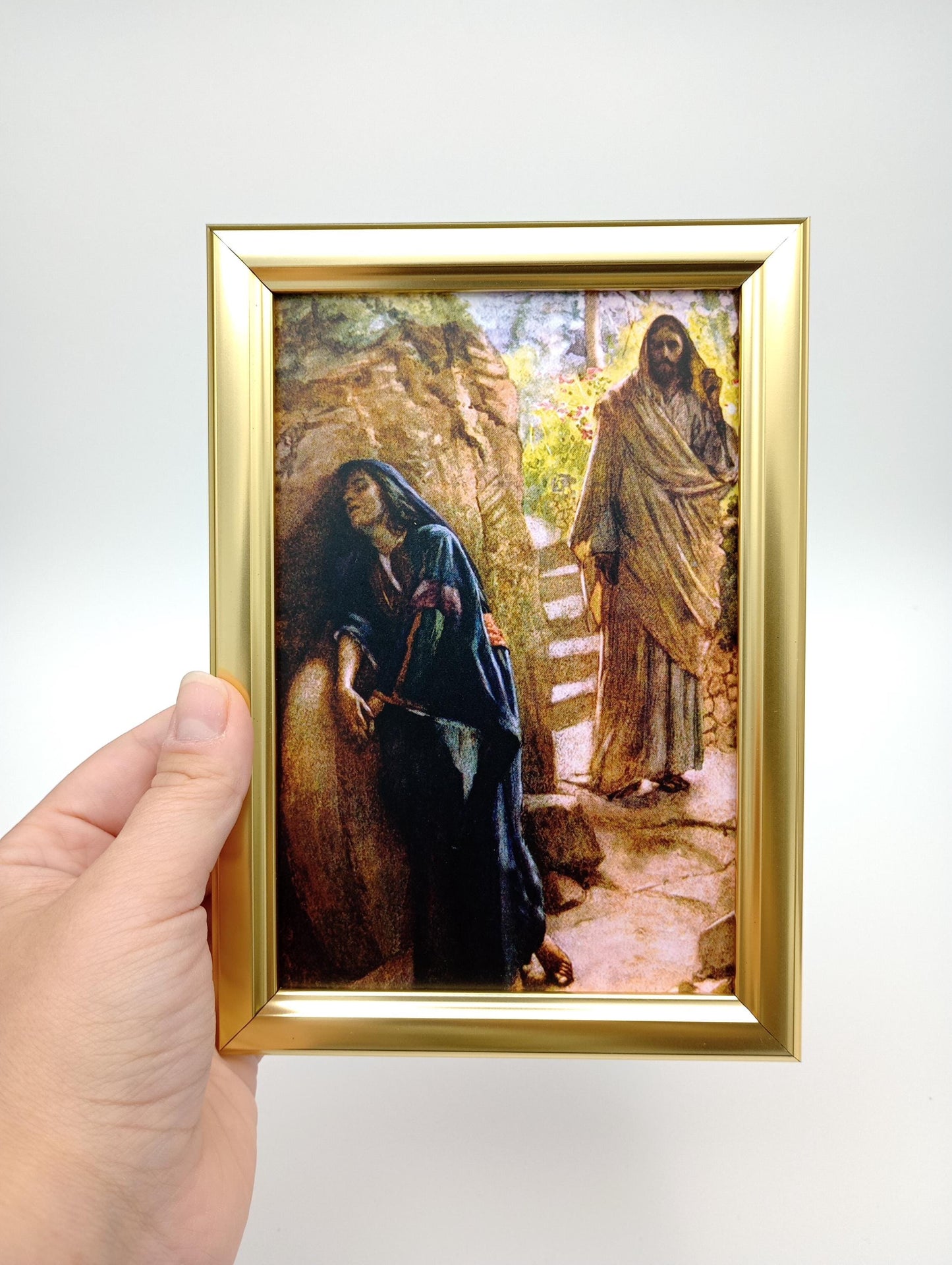 a person holding a picture of a bear in their hand