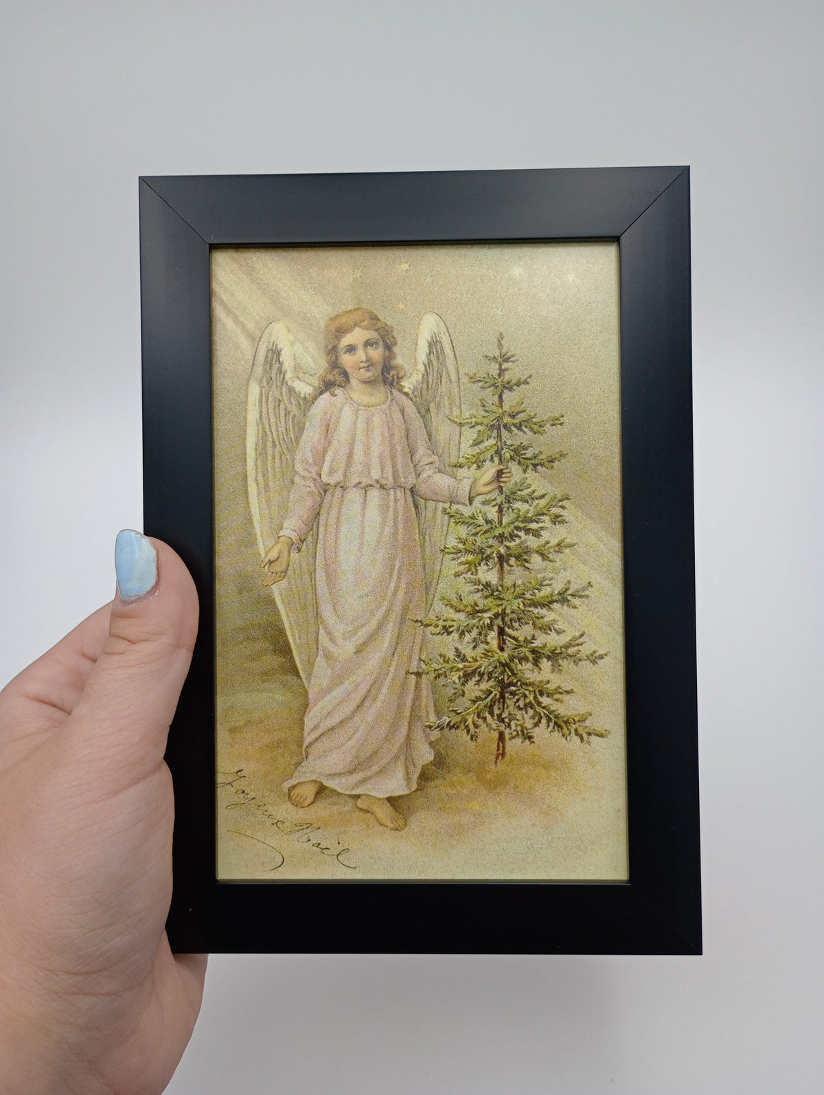 a painting of an angel holding a christmas tree